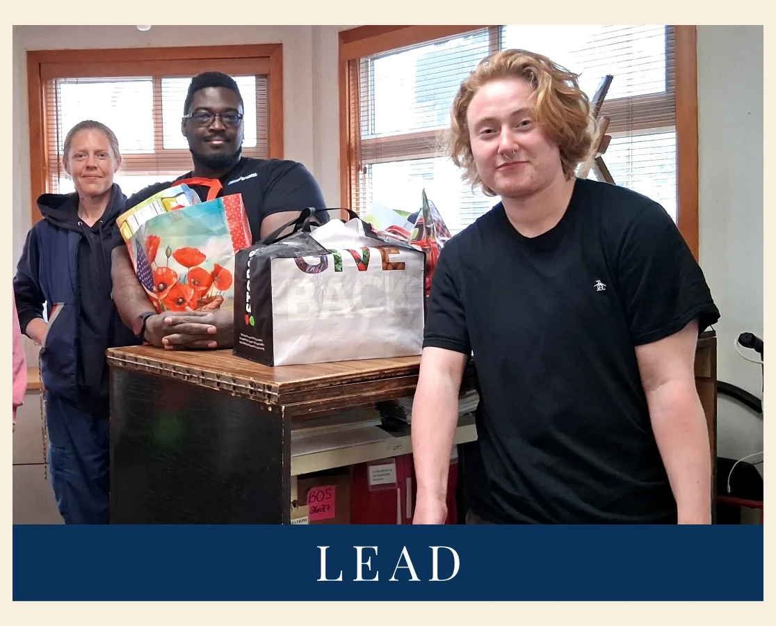 Headline of image says, "LEAD." Above shows a smiling organizer with two volunteers dropping off donation bags. 