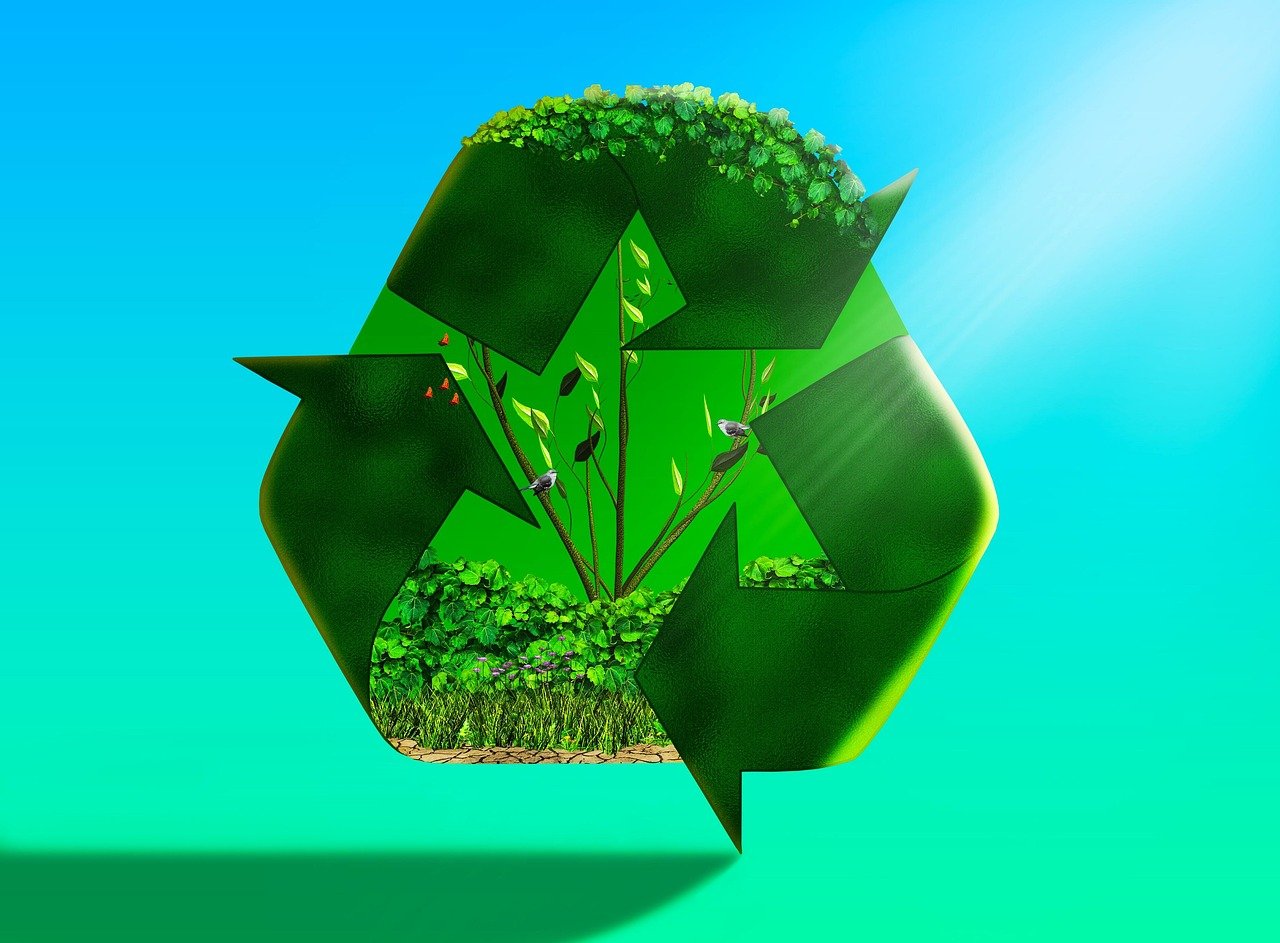 Digital illustration of a green recycle symbol with plants growing on and between the arrows.