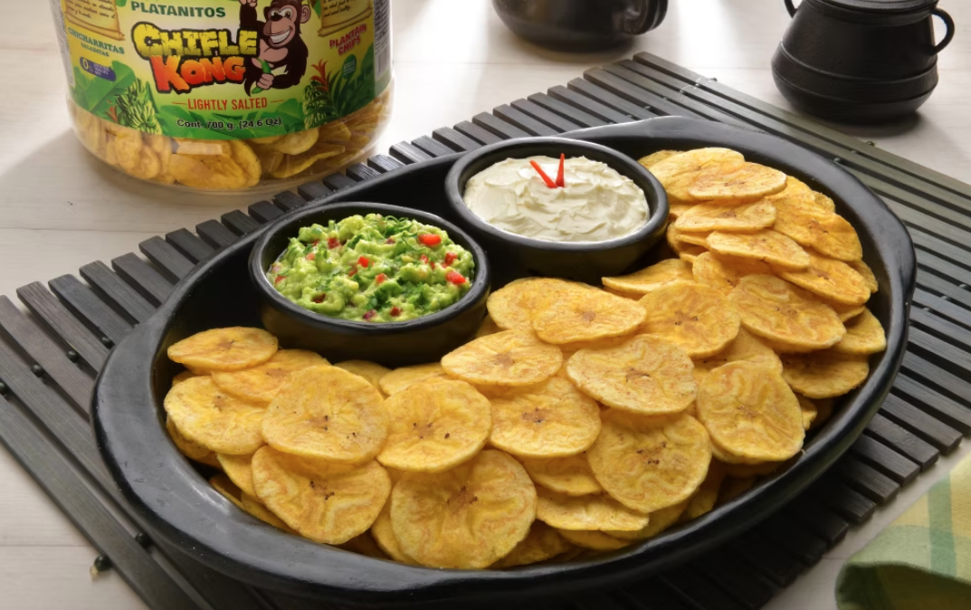Chifle Kon Lightly Salted on a bowl with guacamole and cheese cream sauces