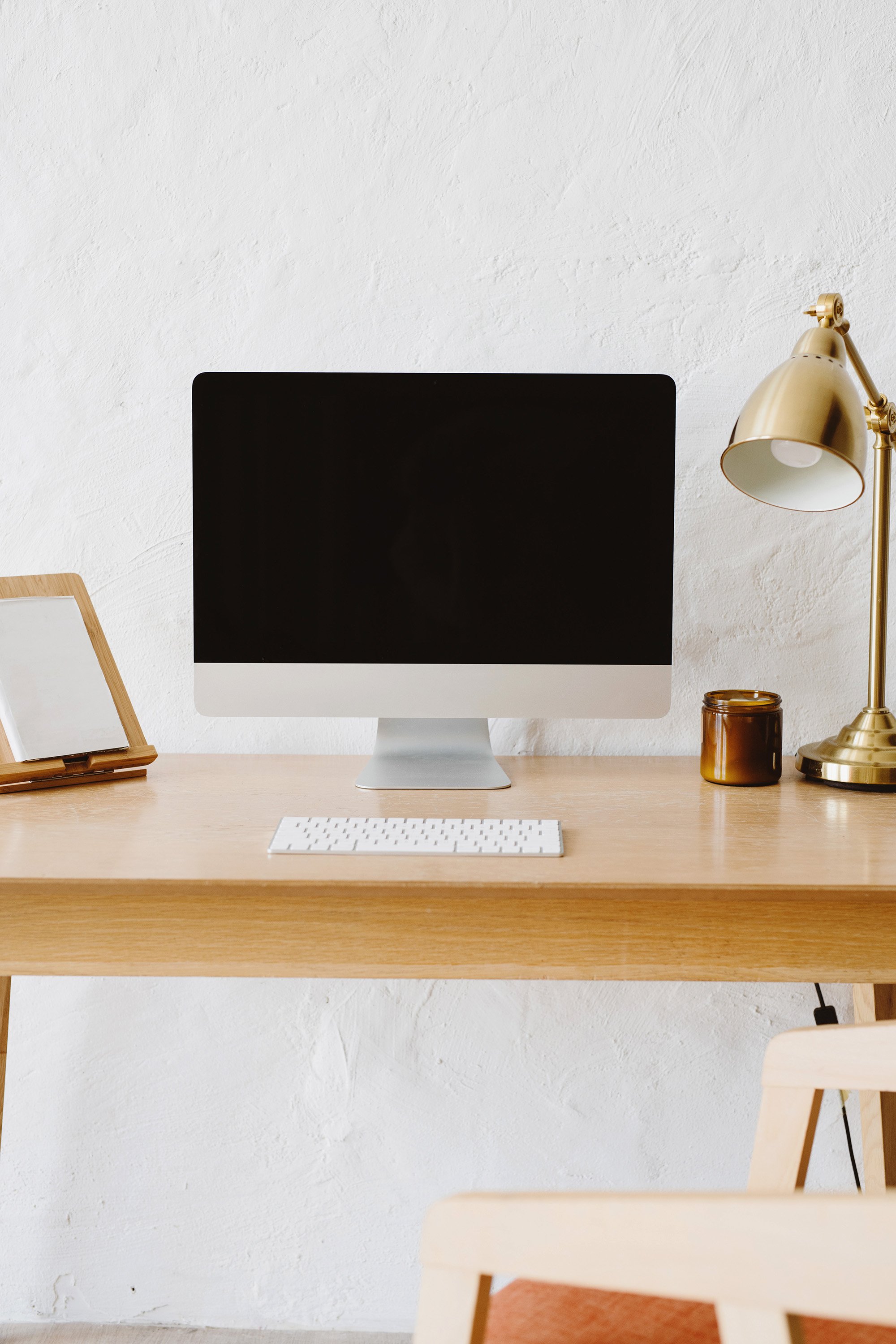 The Olive Branch VA. Neutral desk with iMac and gold lamp