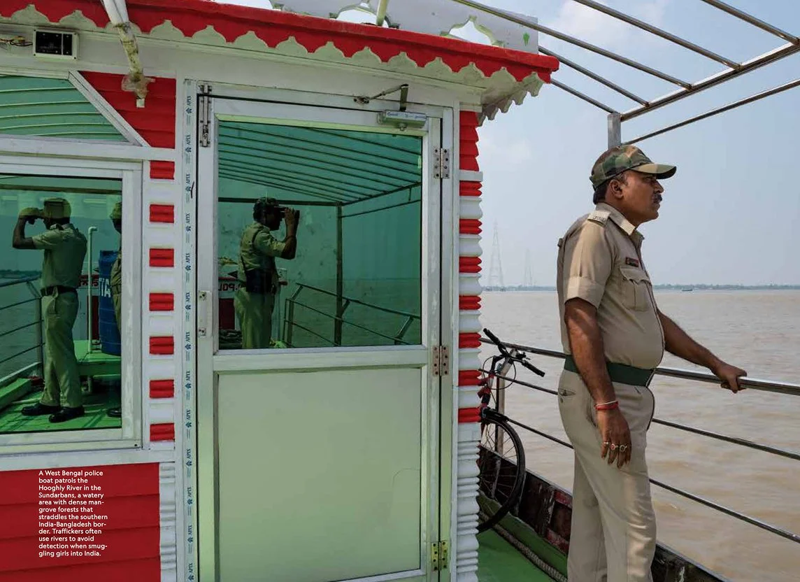 A police officer on a boat patrolling a river