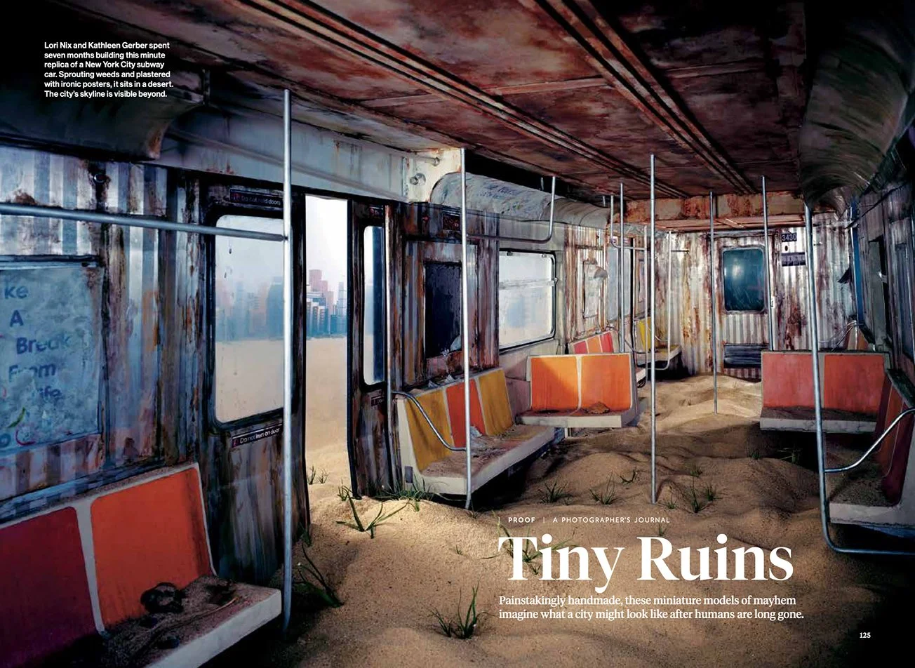 A magazine spread featuring the headline "Tiny Ruins" and an image of an abandoned subway car turned filled with sand