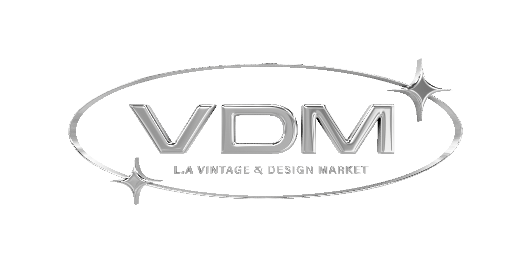LA Vintage & Design Market spinning chrome logo with star accents and oval outline.