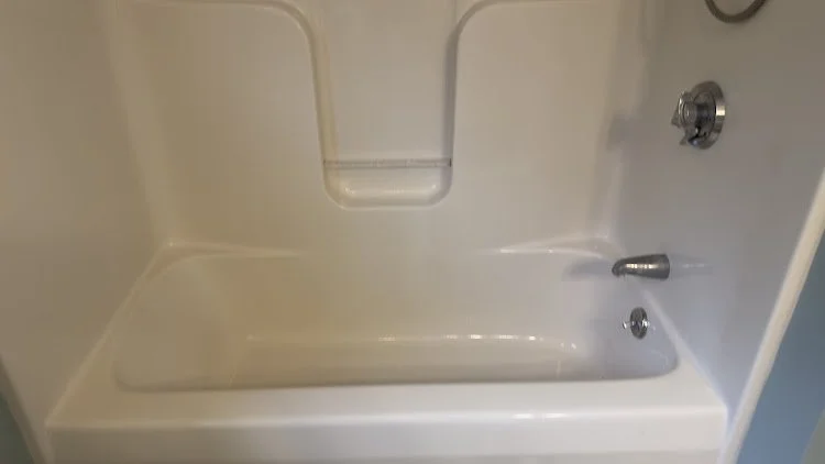 Clean bathtub prepared for move-in or property handover.