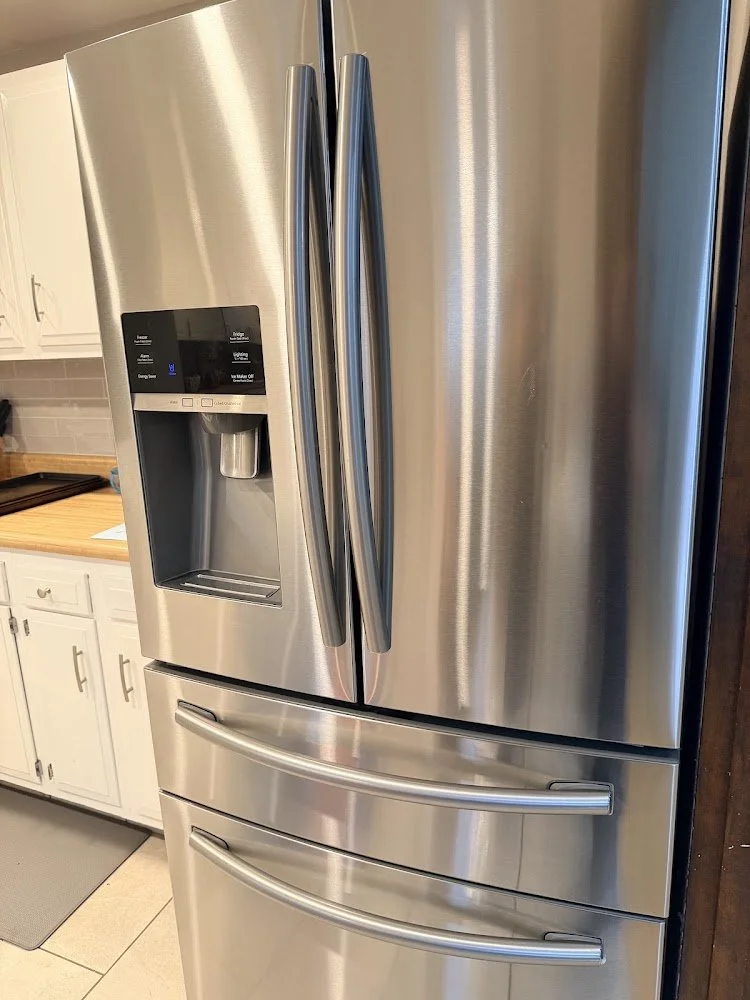 Clean refrigerator exterior in a well-maintained kitchen.