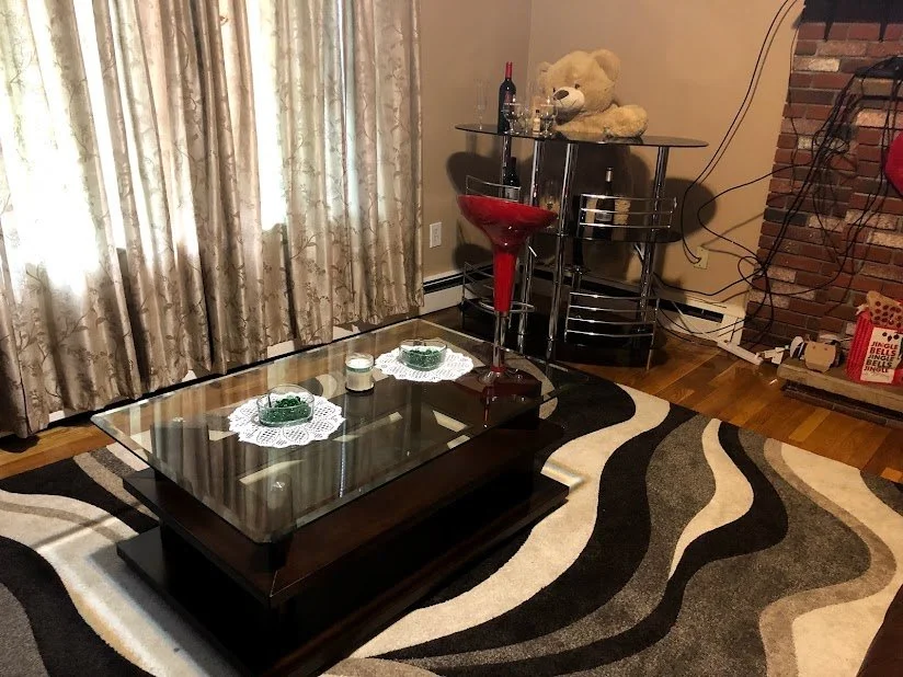 Clean and organized living room prepared as part of a standard residential cleaning service.