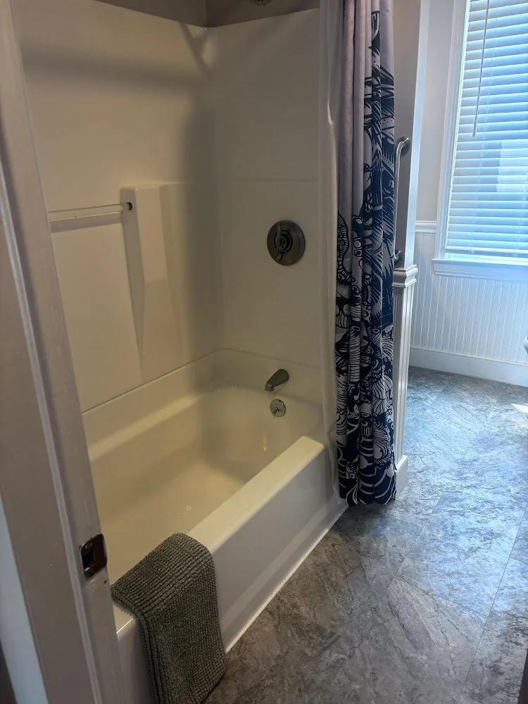 Clean bathtub prepared for guests after an Airbnb turnover cleaning.