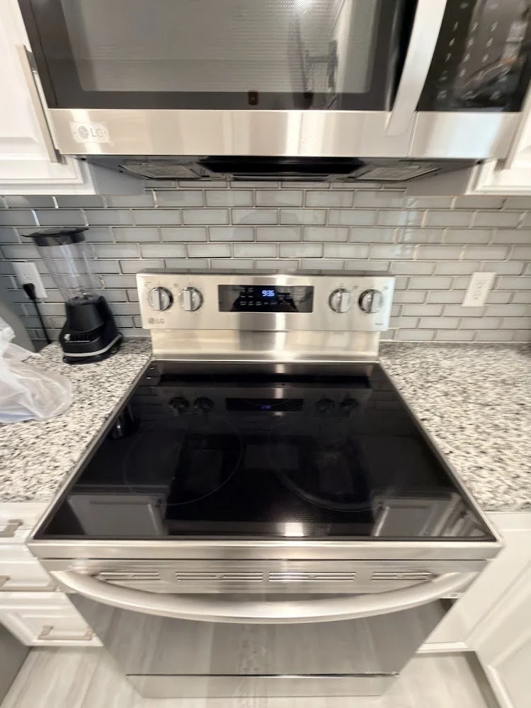 Clean cooktop and microwave ready for move-in or move-out.