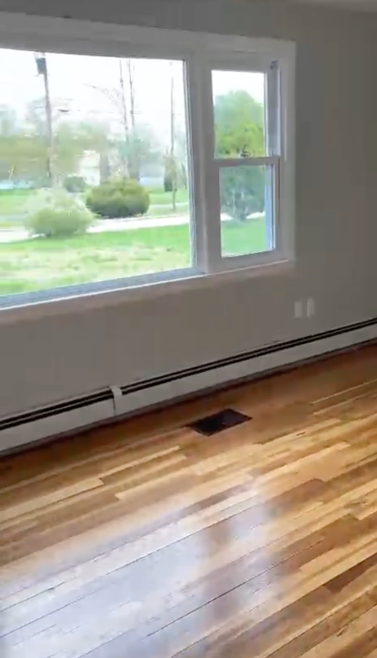 Clean window and freshly cleaned floor ready for move-in or move-out.
