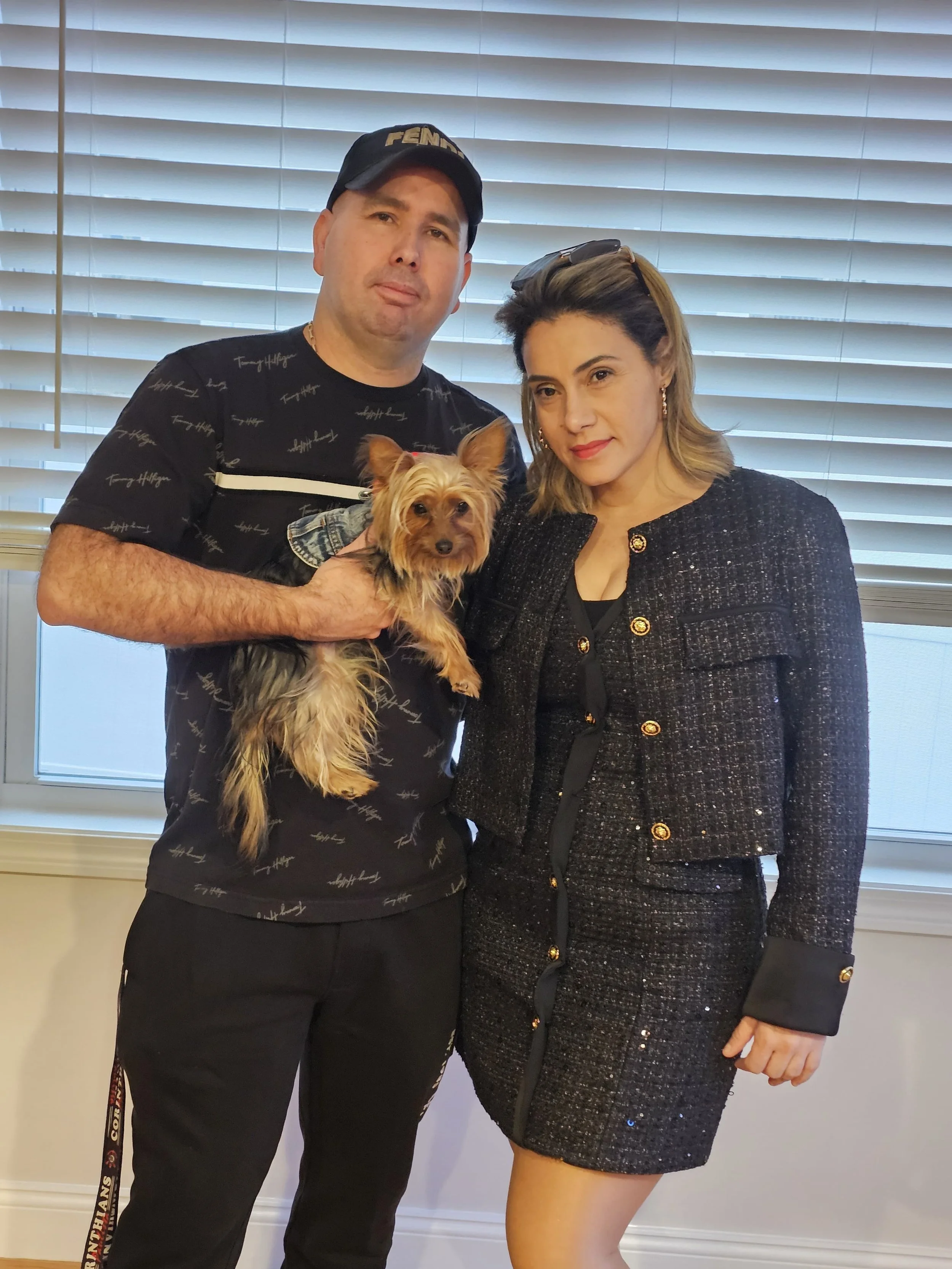 Débora and Reginaldo with Zoe, the mascot of Meireles Cleaning Services, on the About page.