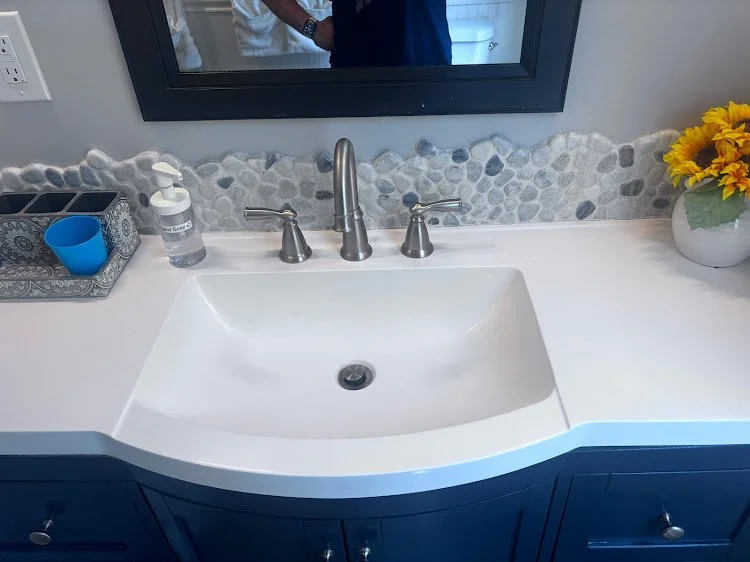 Clean bathroom sink prepared for Airbnb guests.