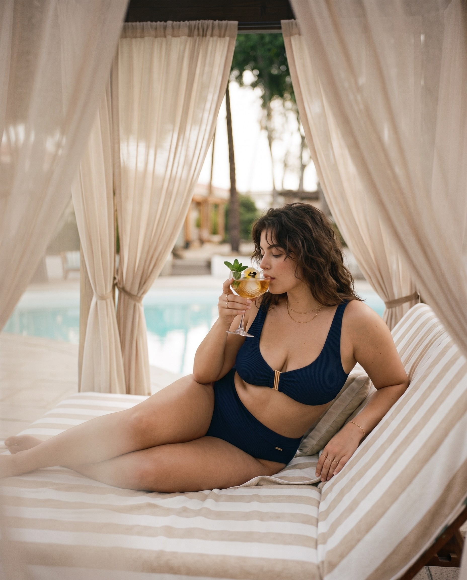 Bikini woman drinking cocktail at a resort | Better Than Jade.png