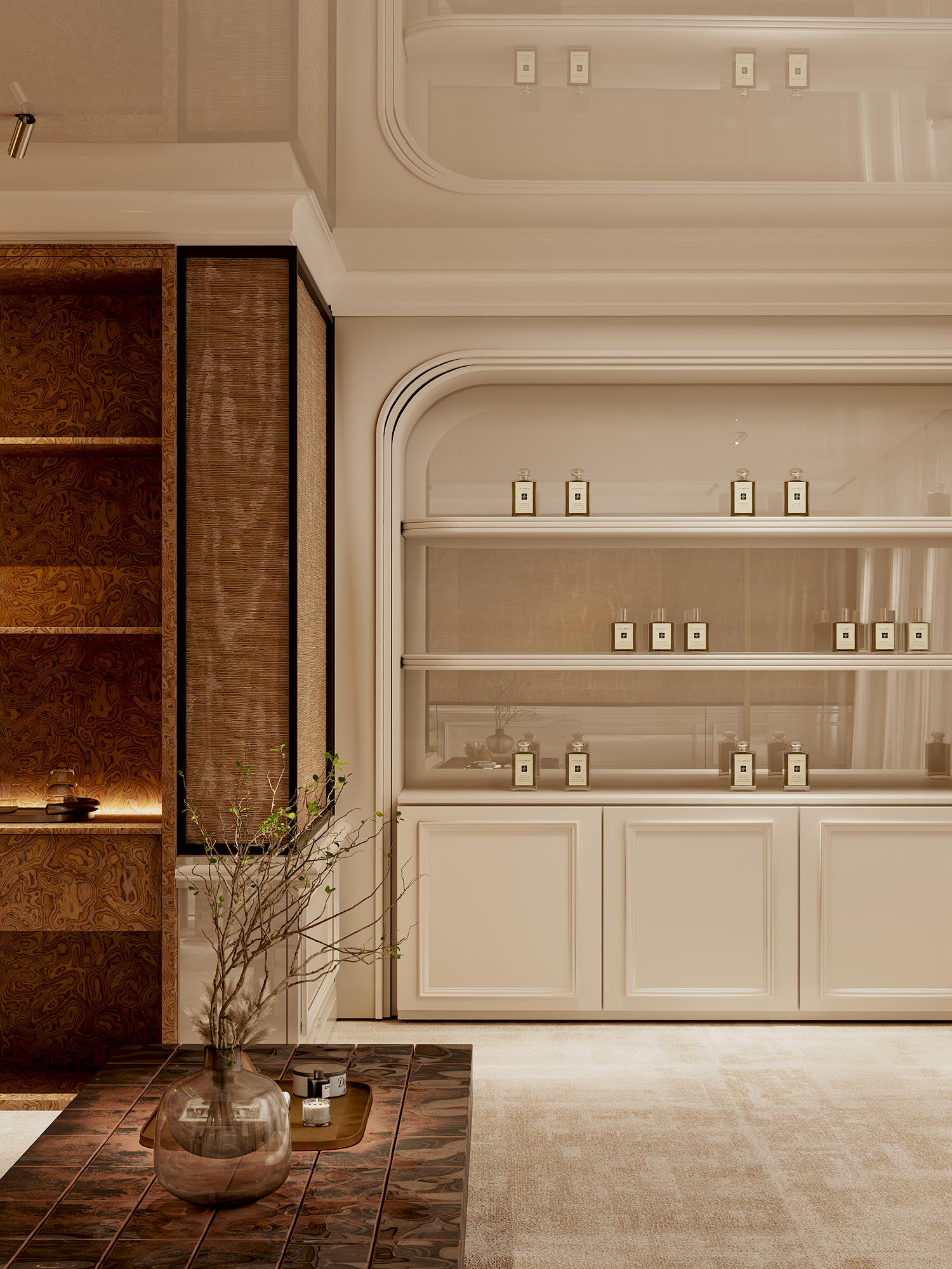 Living room with a wooden shelving unit, a glass vase with branches, a tray with small decor items, and a beige carpet. White built-in shelves display bottles with labels.