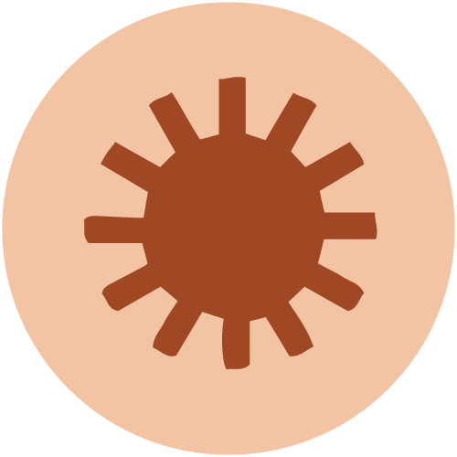 A stylized graphic of a chocolate or brown-colored sun or gear with rays on a beige circular background.