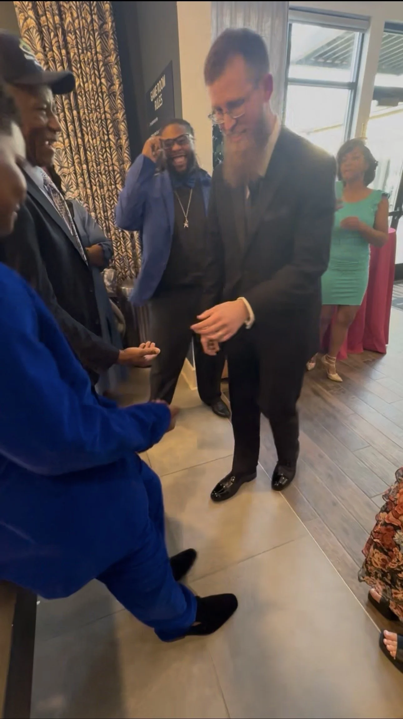 Brandon Johnson performing close-up magic for guests at a wedding reception in Murfreesboro, TN
