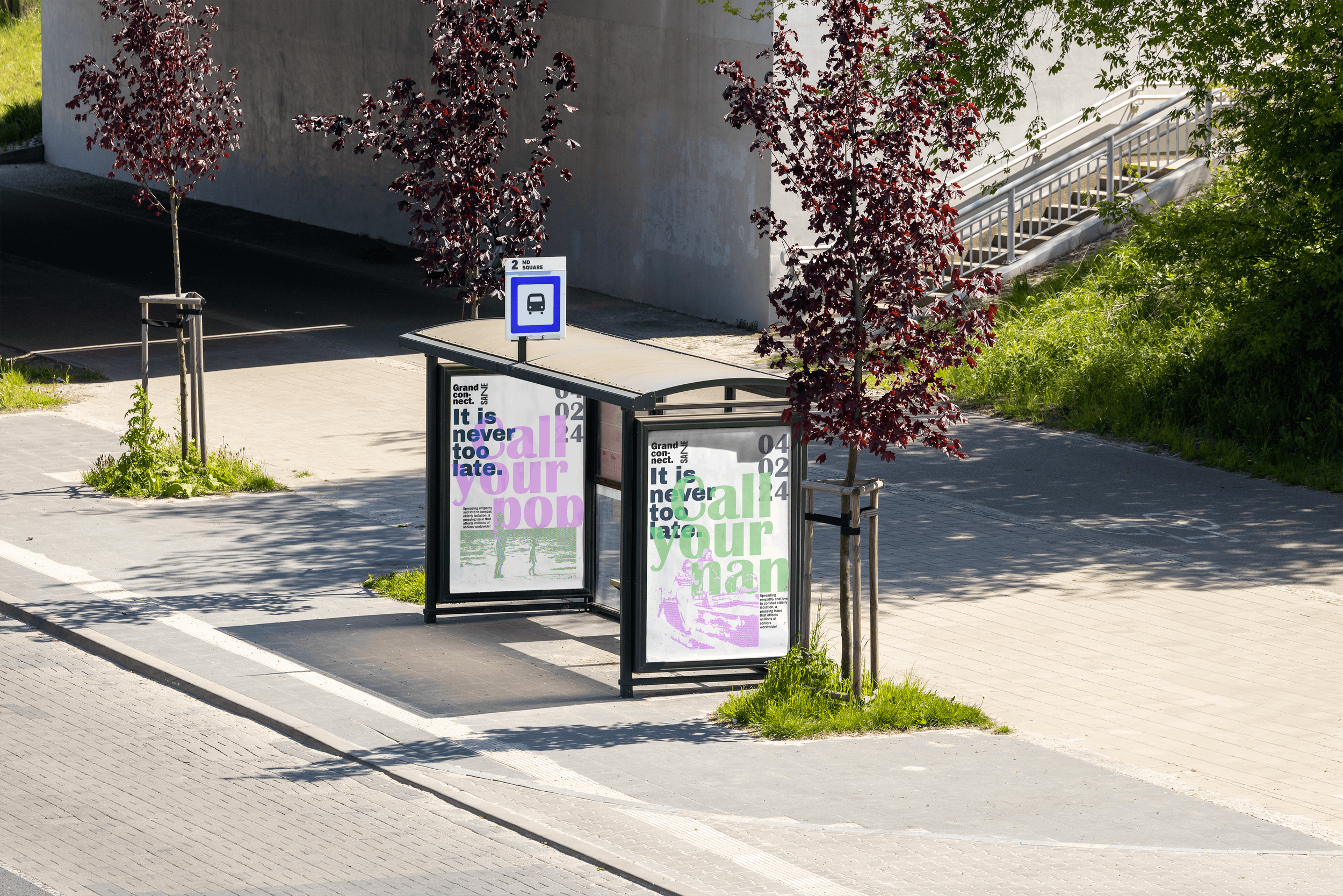 Bus stop with digital advertisement panels, surrounded by trees and bushes, in an outdoor urban setting.