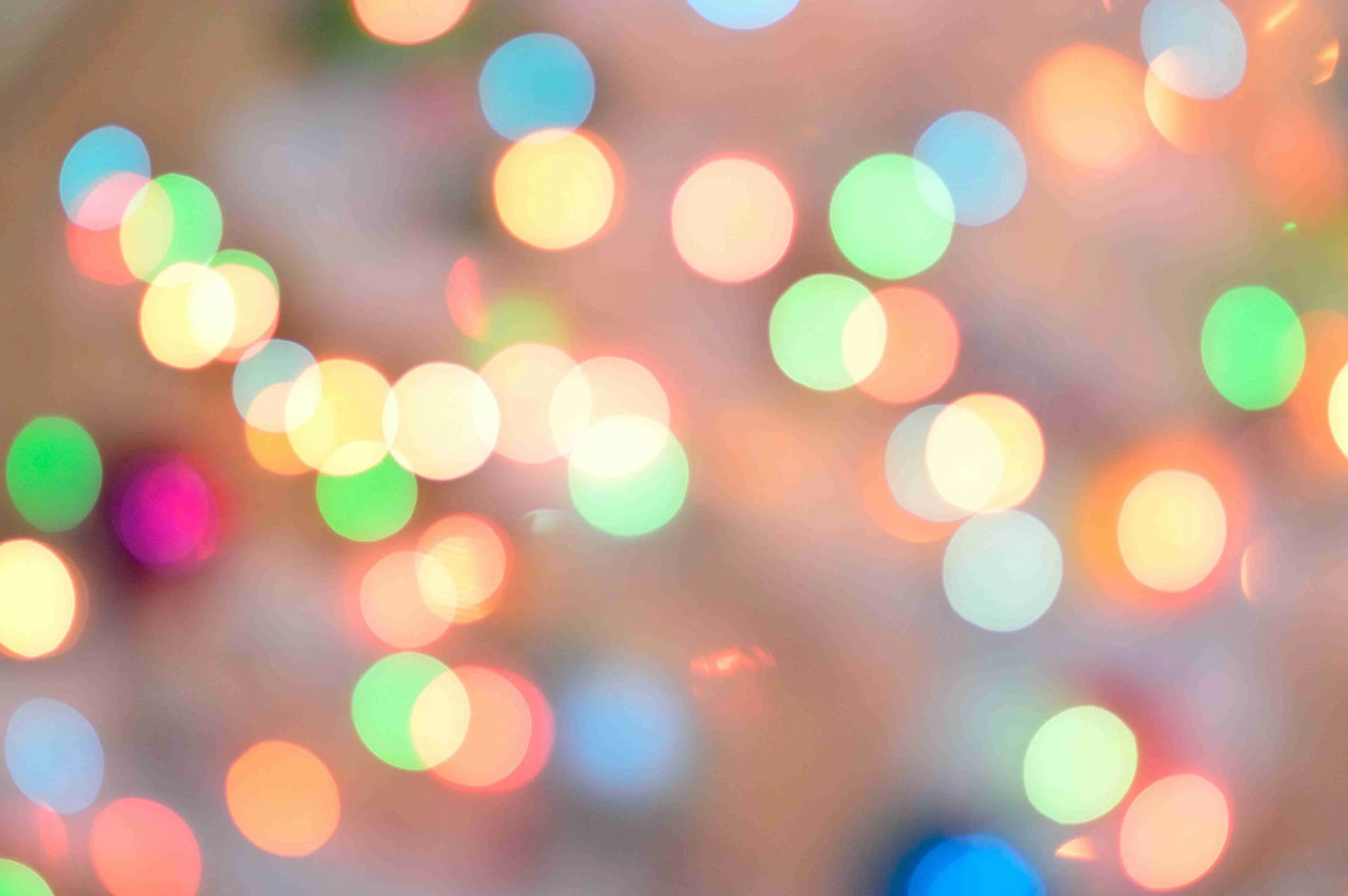Blurred multicolored bokeh lights creating a festive, out-of-focus background.