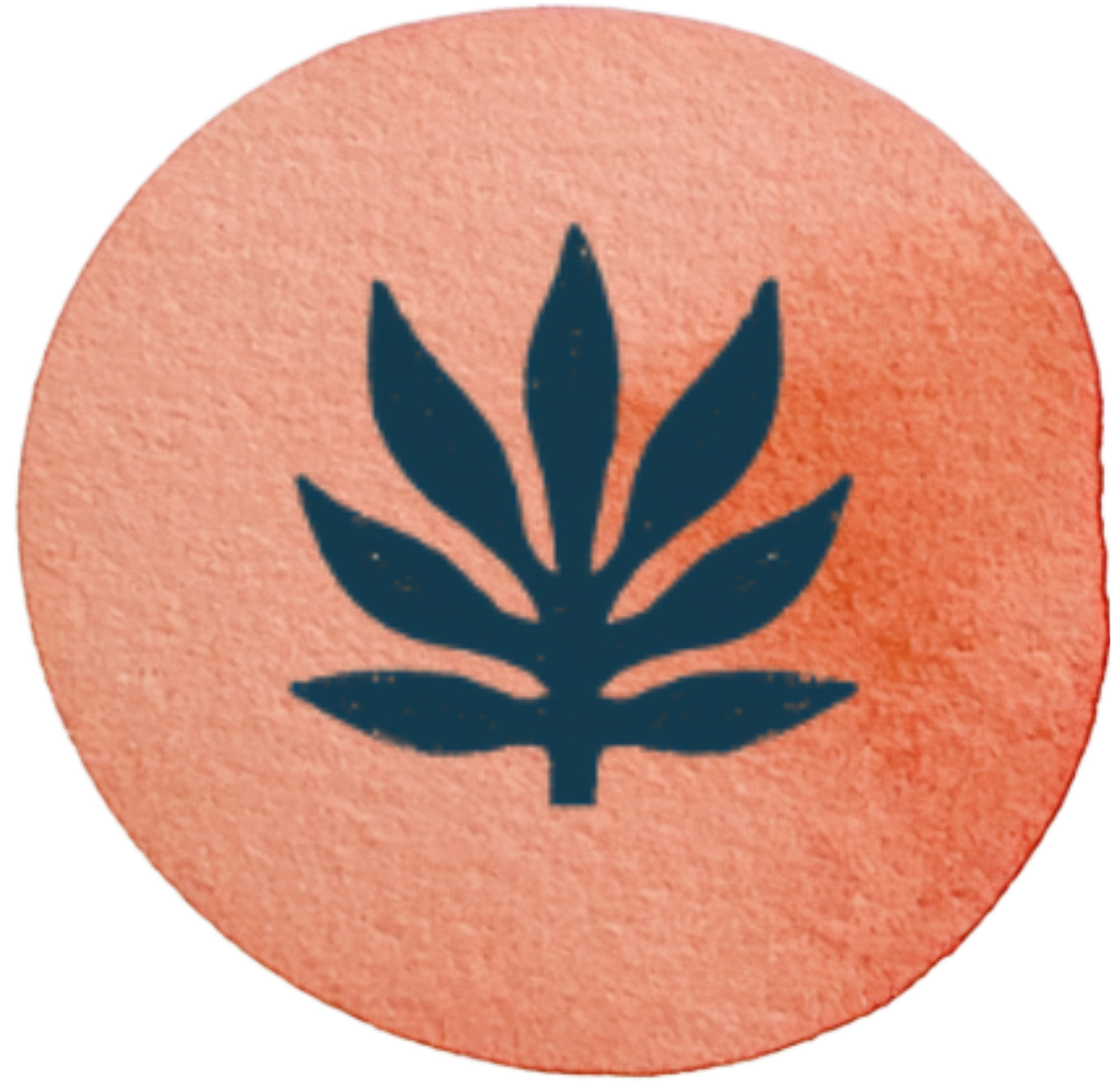 Close-up of an orange circular sticker with a blue leaf symbol in the center.