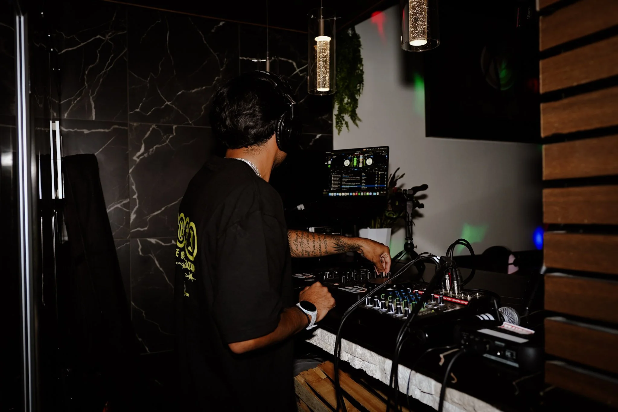 DjAnt performing for a run club at a coffee shop.