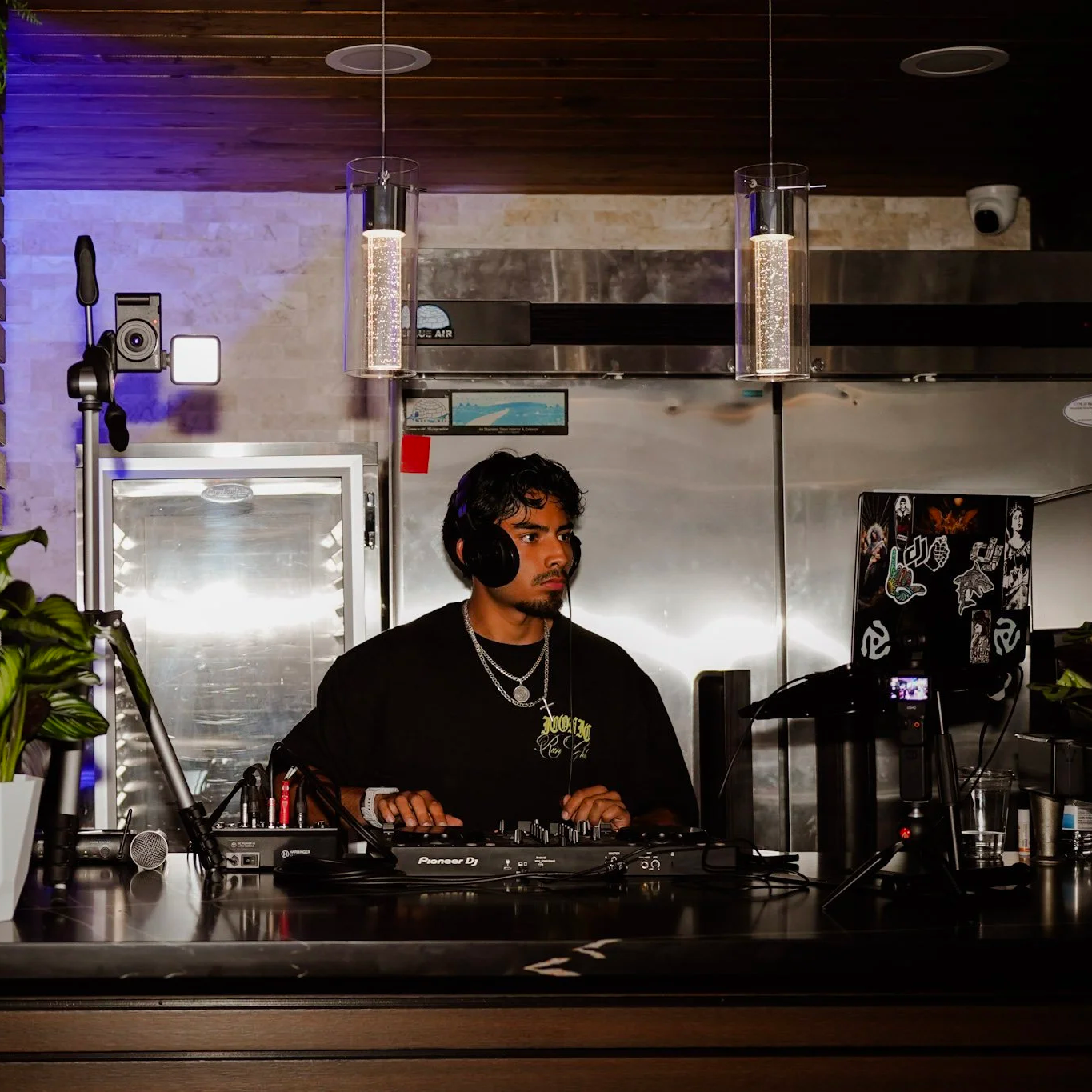 DjAnt performing for a run club at a coffee shop.