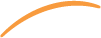 A close-up of a black and orange cat lying on a wooden surface, looking at the camera.