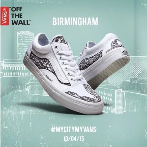White Vans sneakers with black graffiti-style designs on the sides and toes, displayed against a light teal background with cityscape outlines, featuring the Vans logo, the word "Birmingham," and hashtags indicating a city-specific sneaker customization event.
