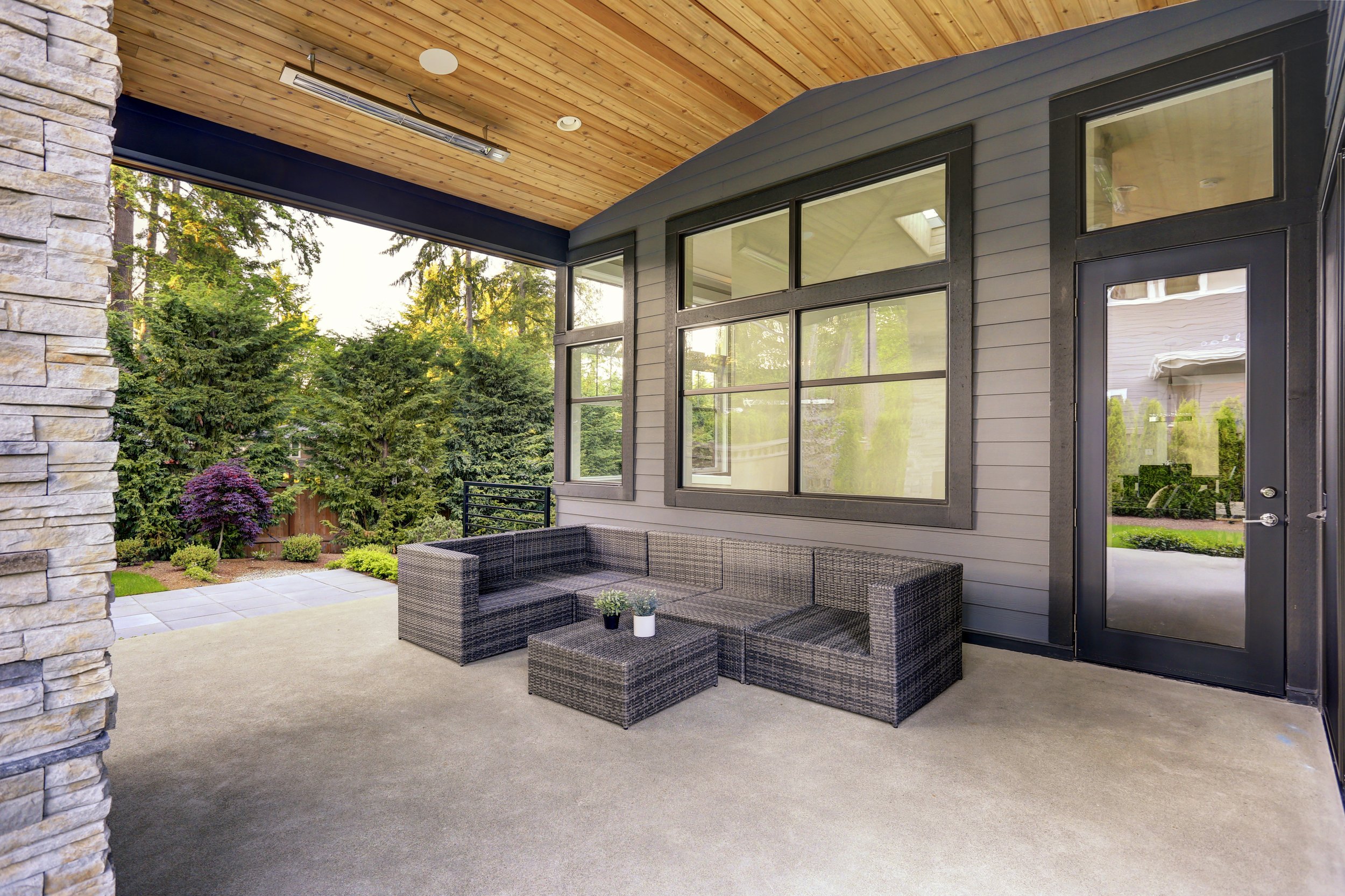 Back patio with large windows and a modern door. 