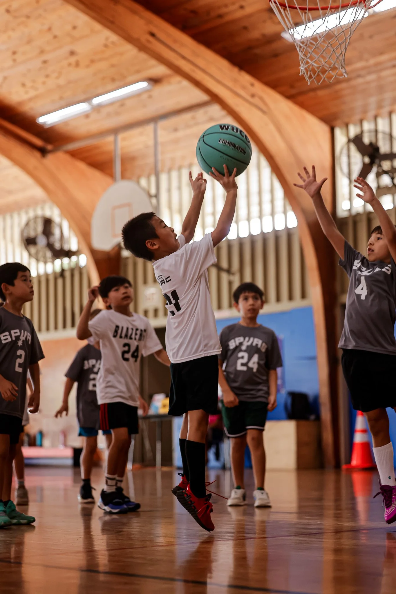 Young child aims for the hoop
