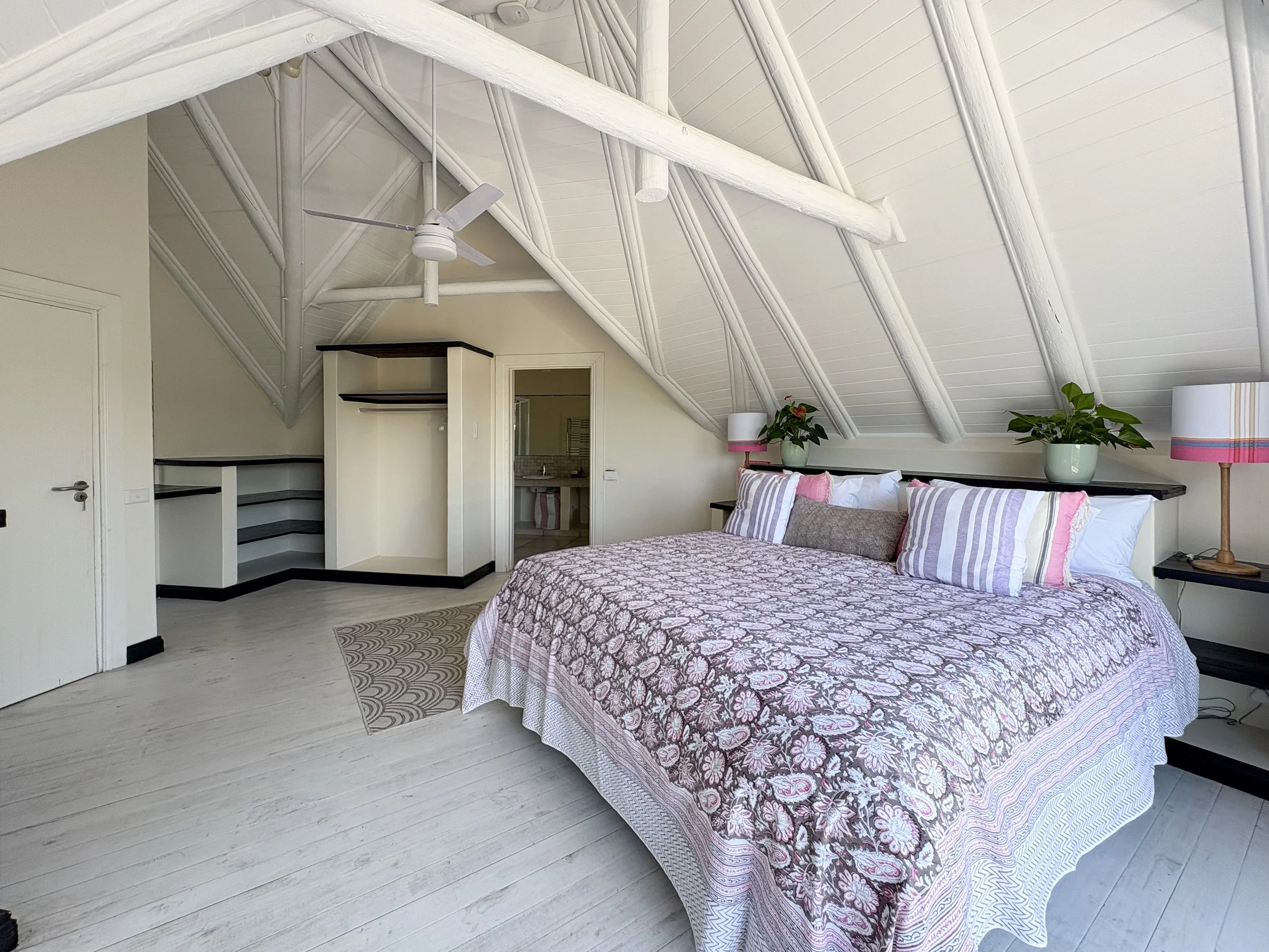 Open-plan bedroom with built-in wardrobe