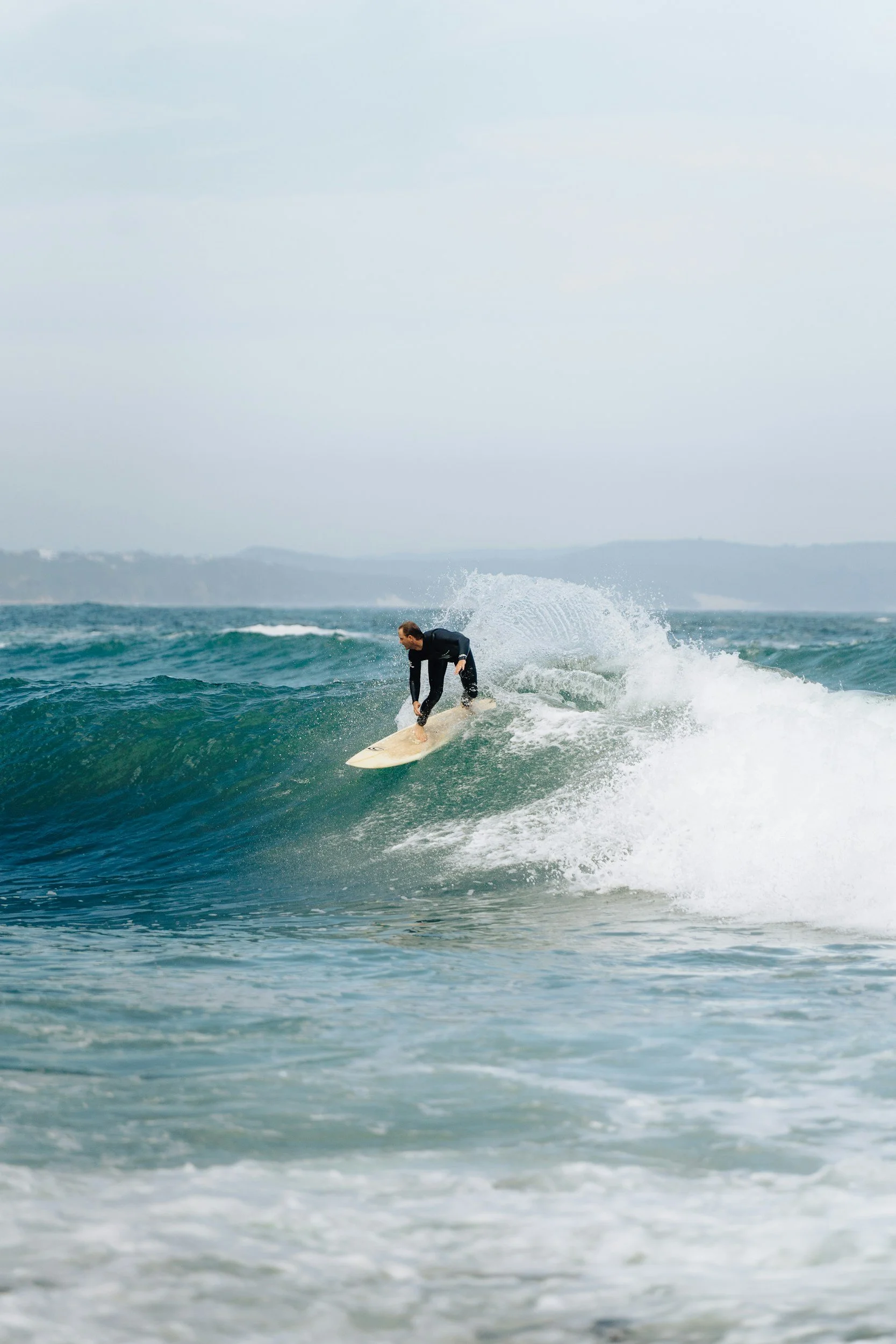 Surfer riding a wave near St Francis Bay