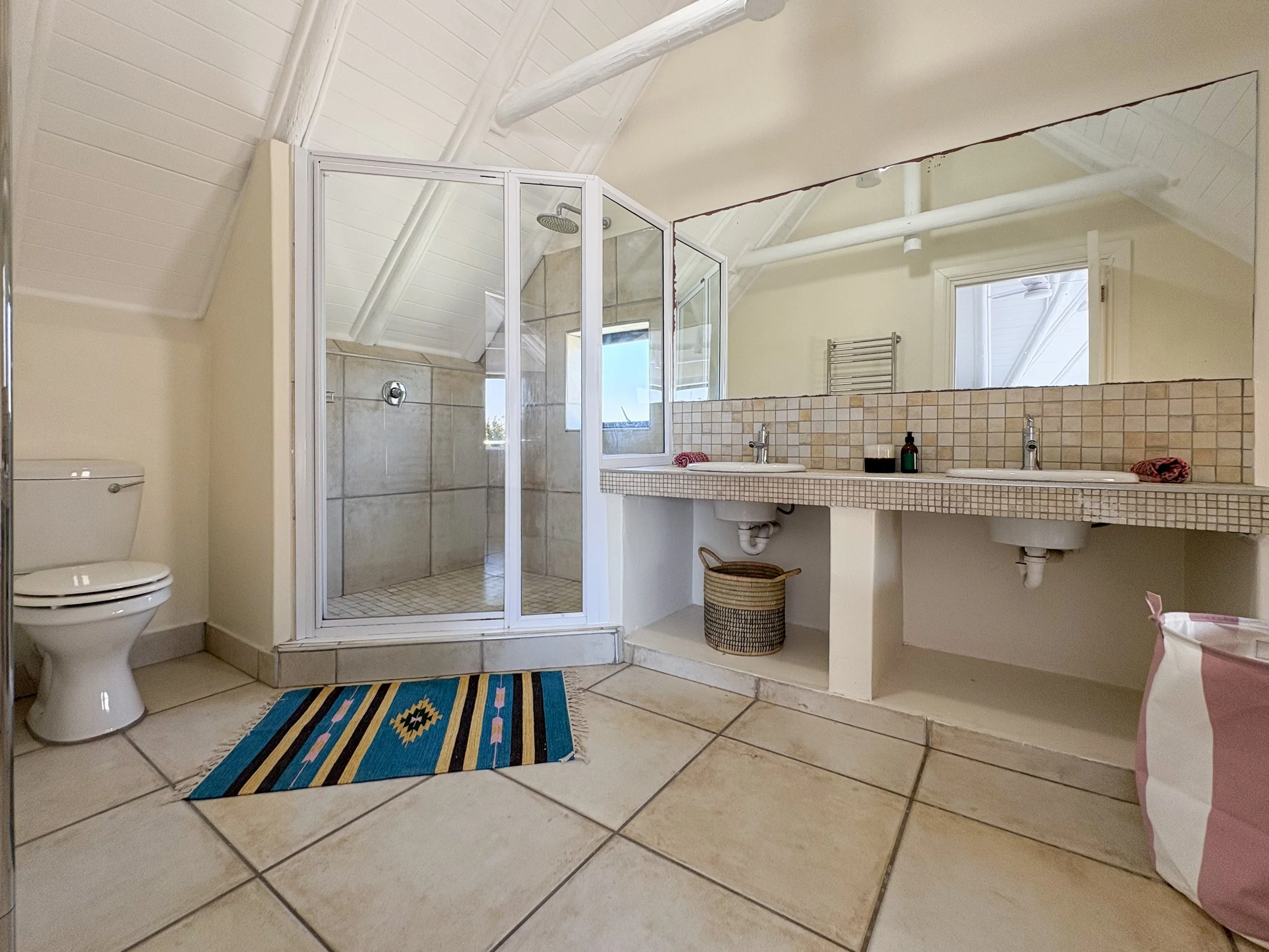 En-suite bathroom with glass shower and double vanity