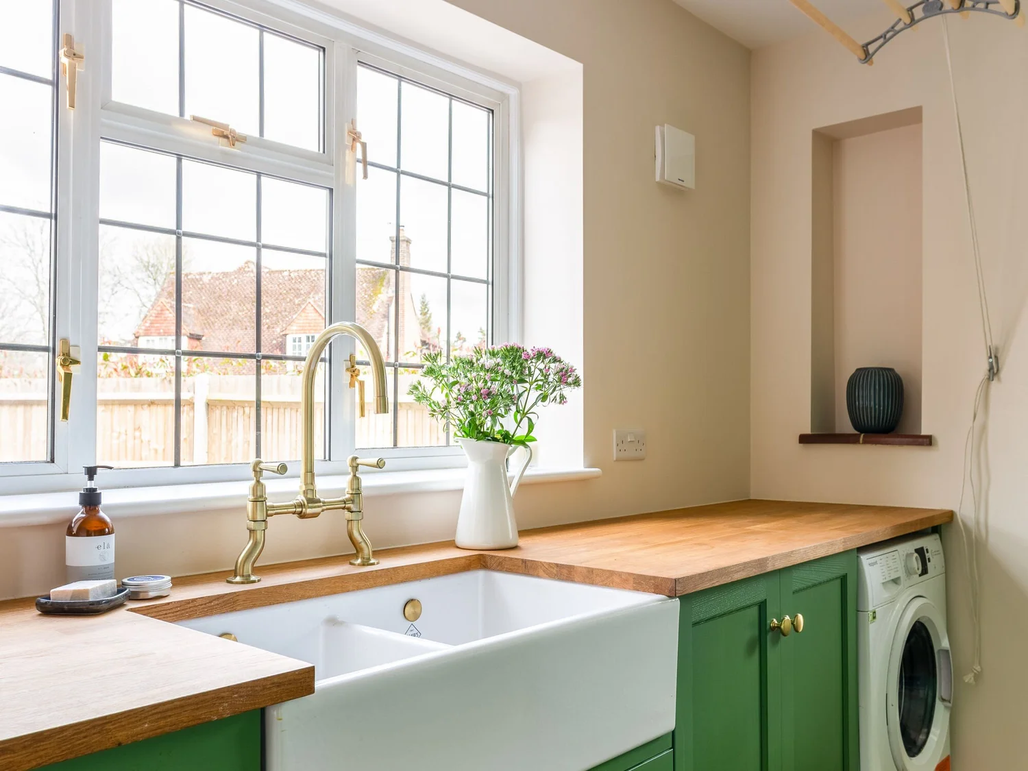 Utility room with fitted sink, timber worktop and washing machine