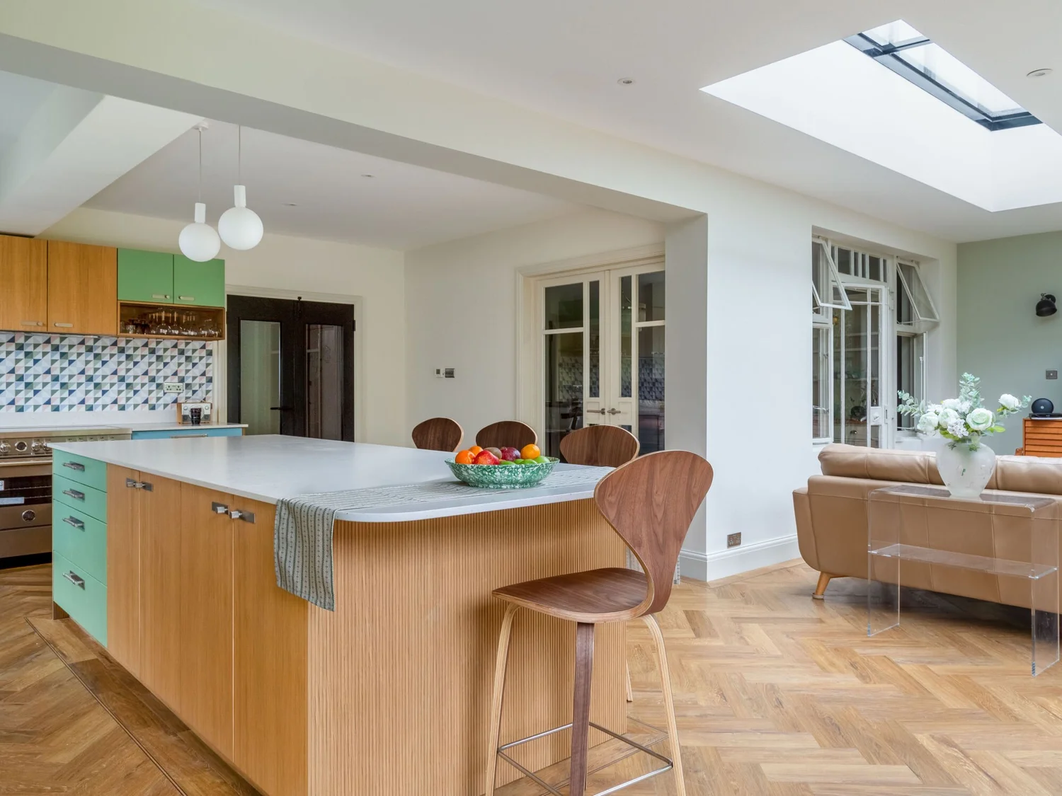 Completed kitchen with timber island, dining area and rooflight
