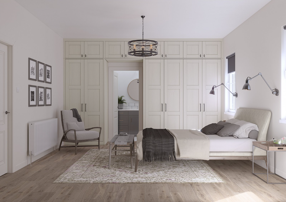Shaker-style fitted wardrobes surrounding a bedroom doorway