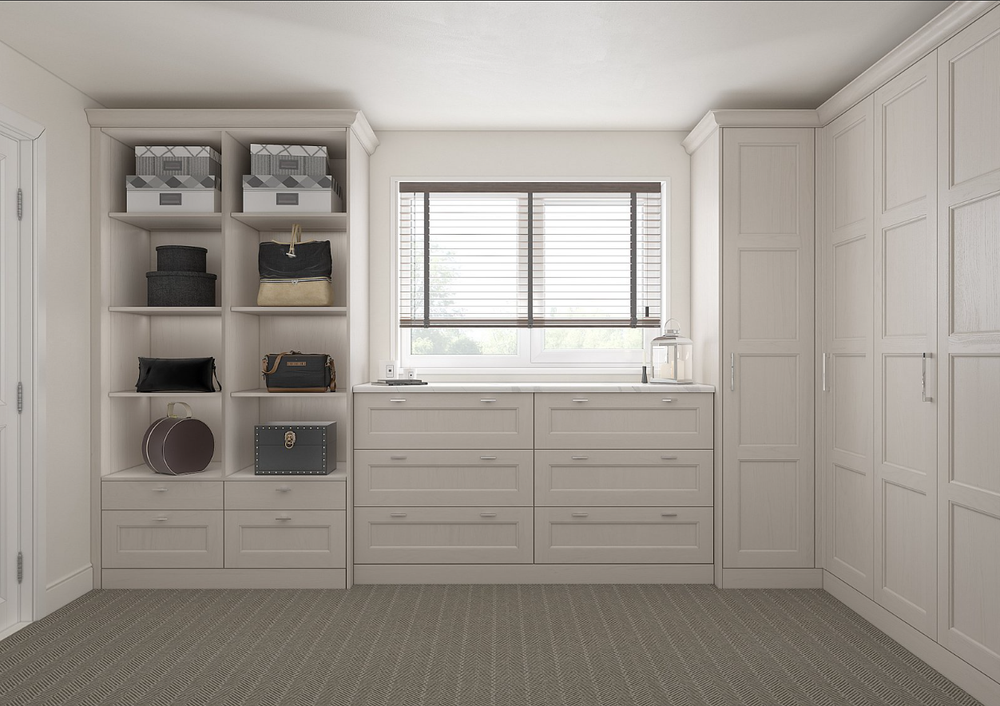 Traditional fitted bedroom storage with wardrobes, drawers and open shelving