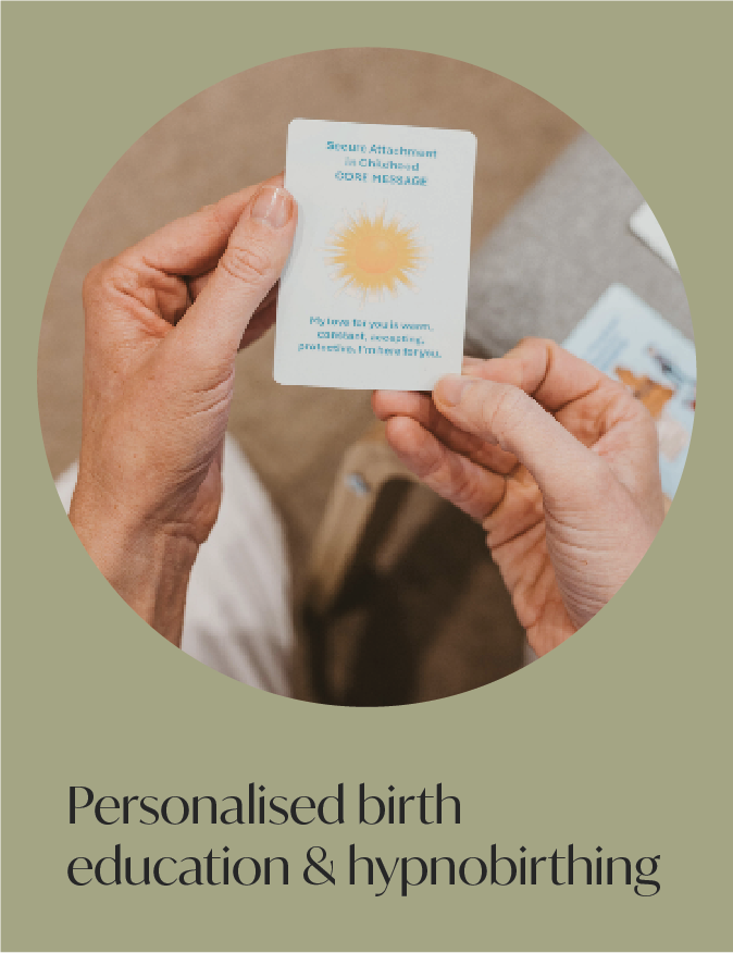 Person holding a card with the sun illustration and text about secure attachment in childbirth.