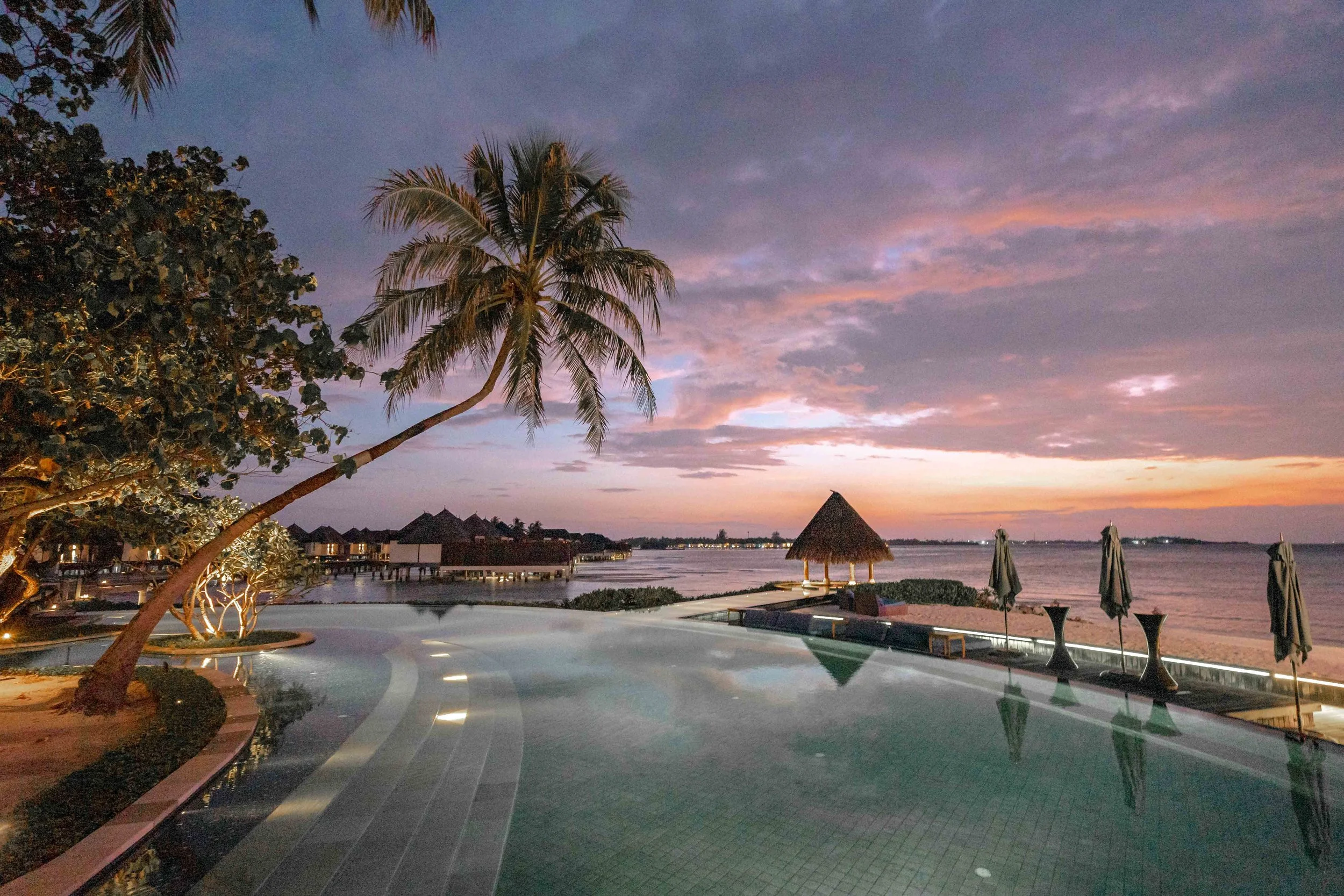 Boutique resort poolside, Maldives— Passport with Paris