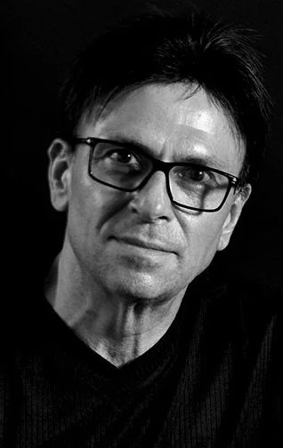 Black and white portrait of composer, arranger & conductor Rolf Becker