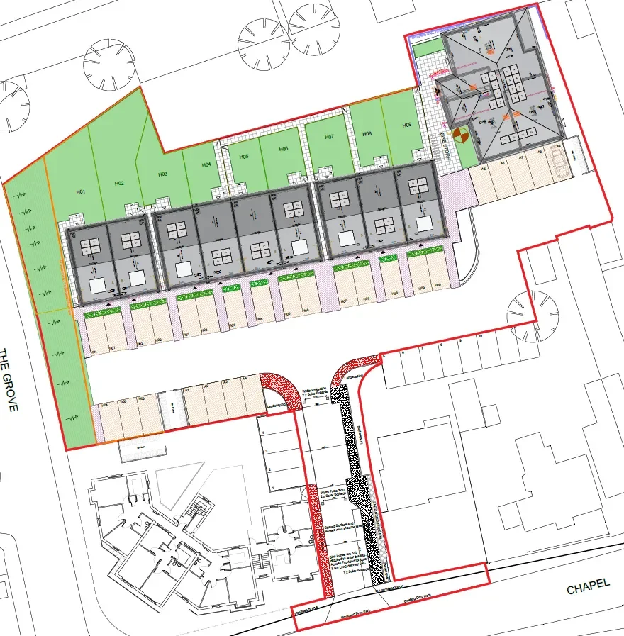 A site plan for a residential or commercial development featuring multiple buildings, parking spaces, green areas, and landscaping details.