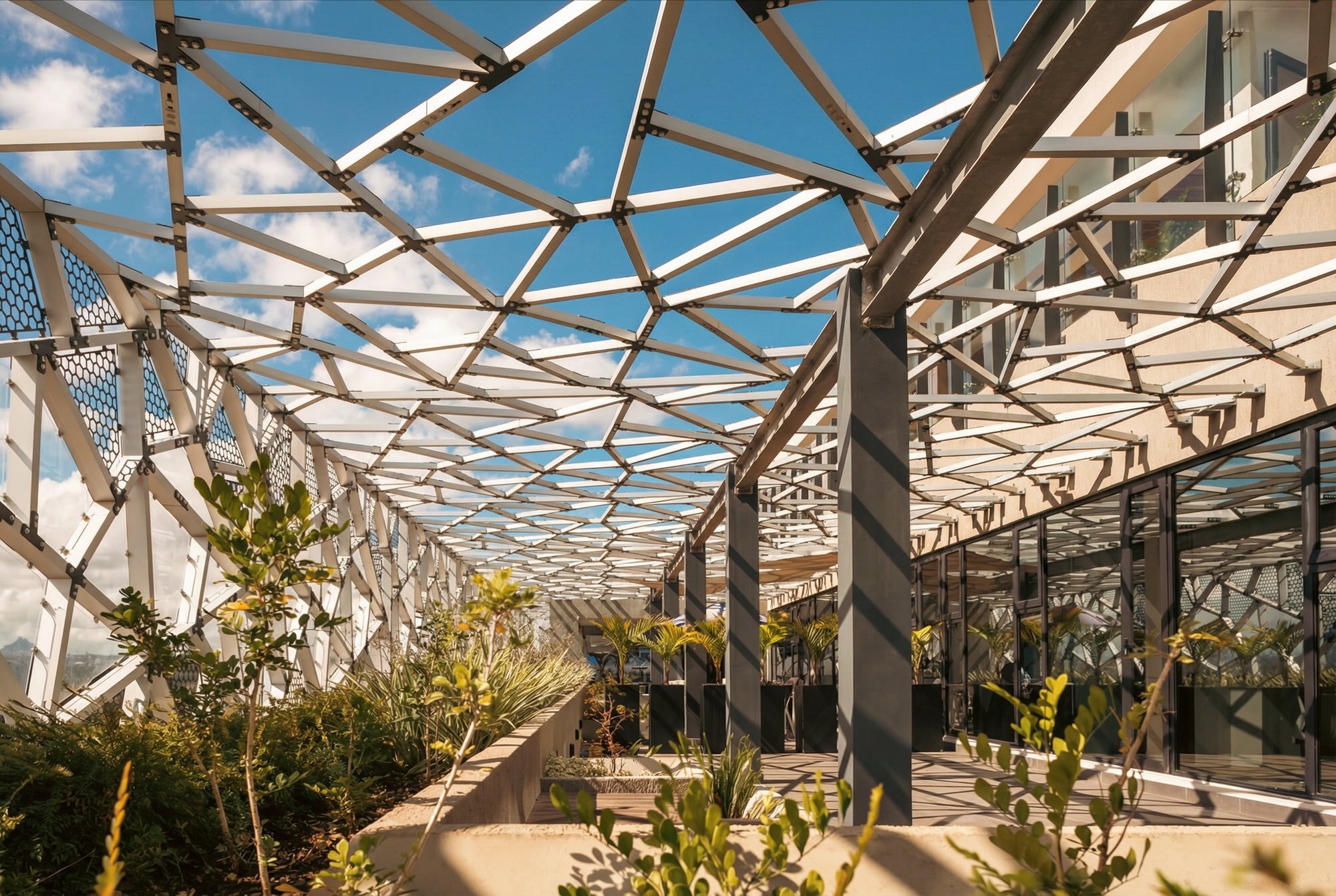 Icone Ebene — glass roof and geometric structural framework.