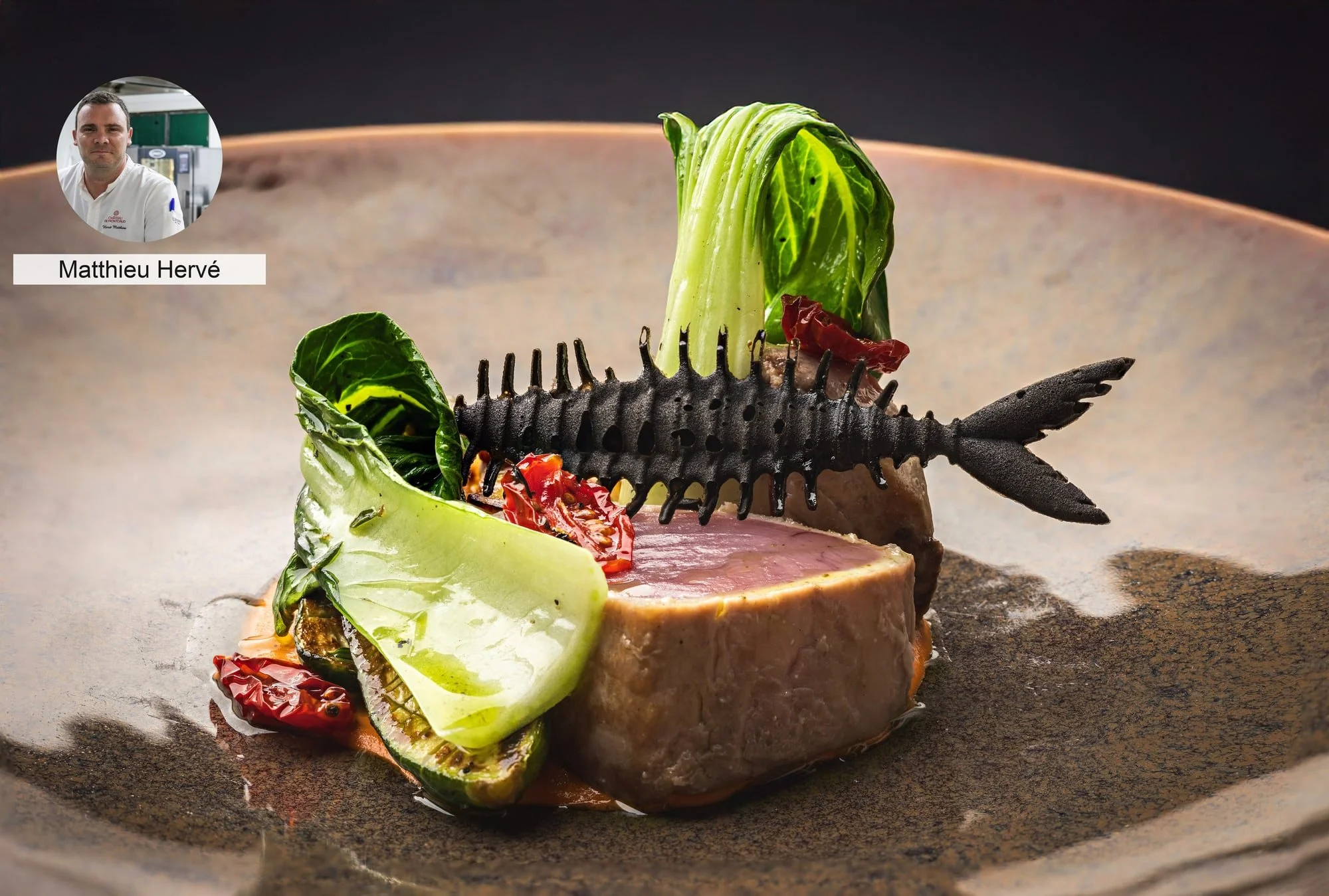 Sliced meat with sculptural crisp garnish by chef Matthieu Hervé.