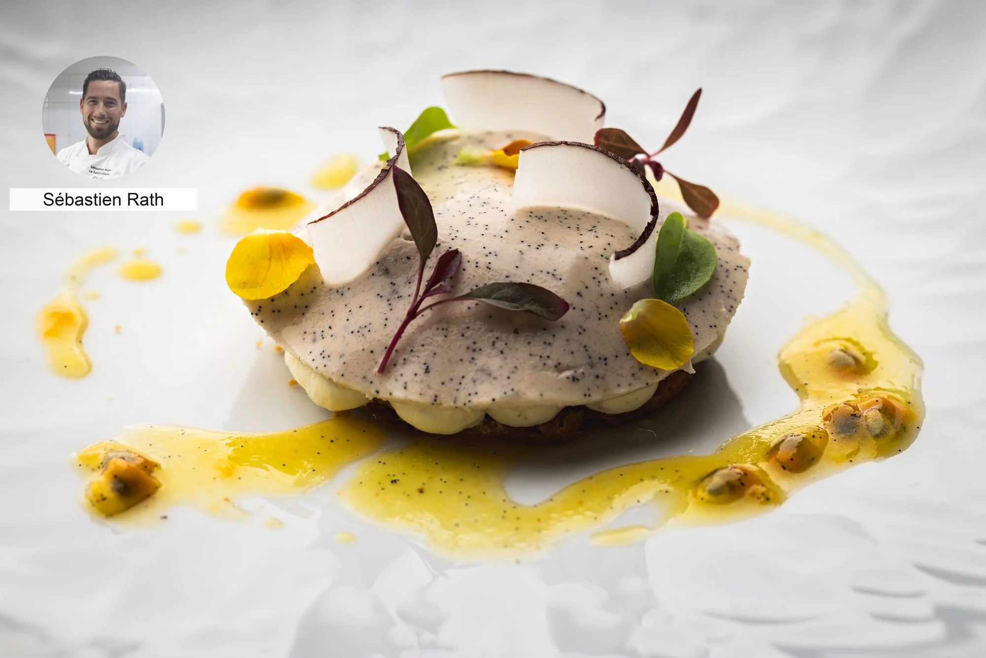 Dessert with fruit and floral garnish by chef Sébastien Rath.