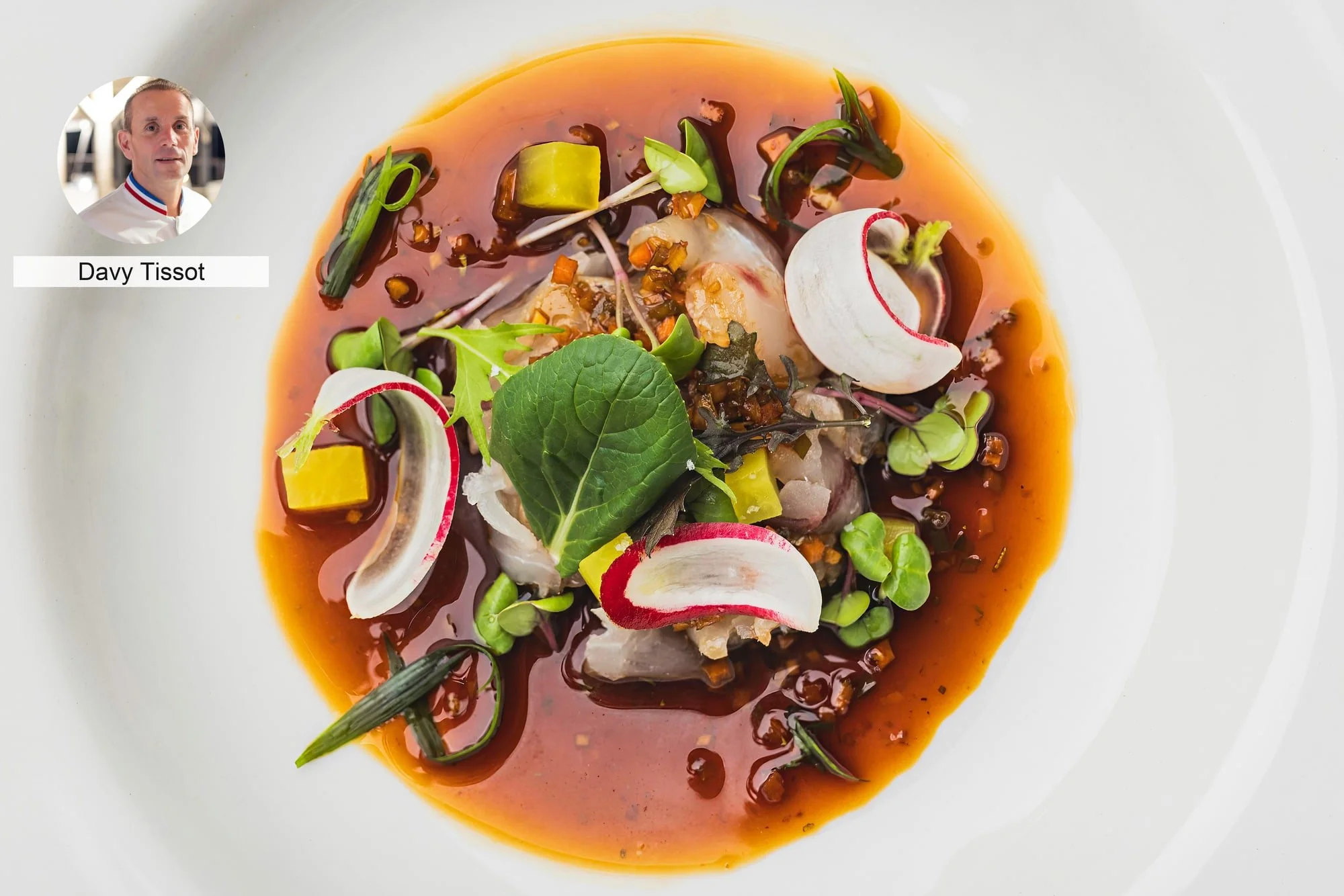 Colourful vegetables with sauce by chef Davy Tissot, presented as fine dining.