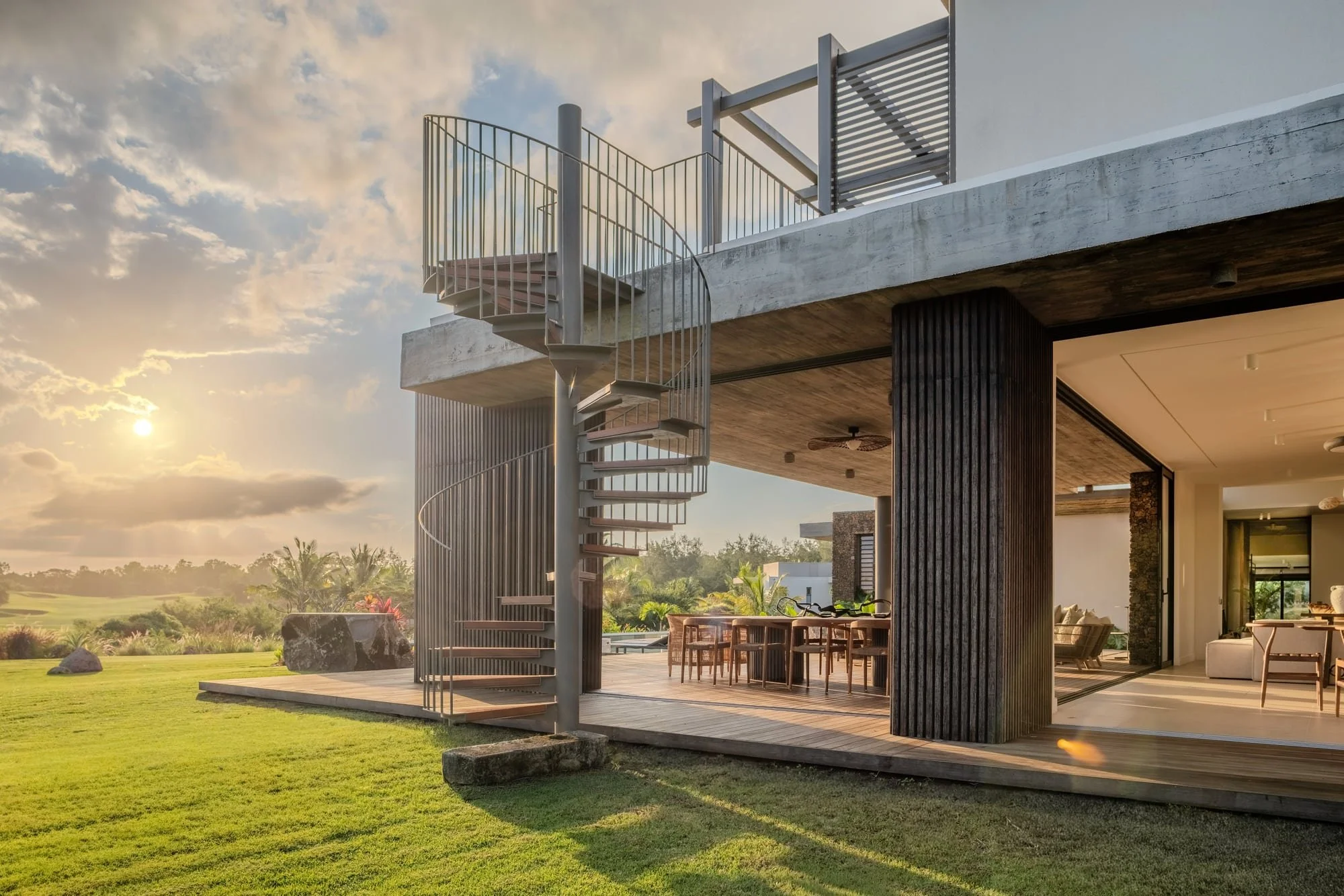 Villa Anahita H15 — concrete facade and exterior staircase in evening light.