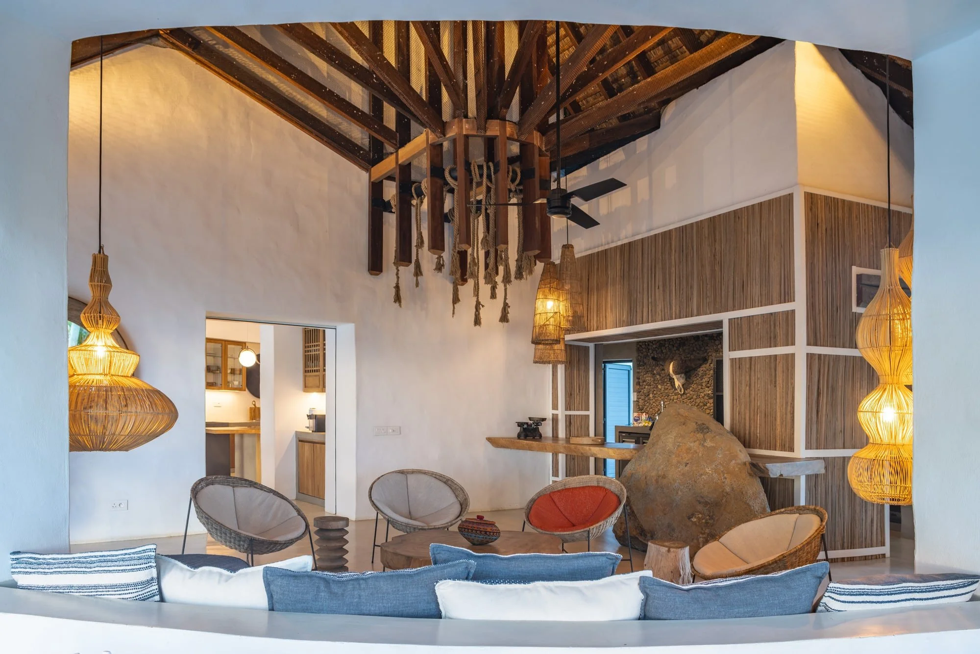 Muse Villa — double-height living room with exposed timber structure.
