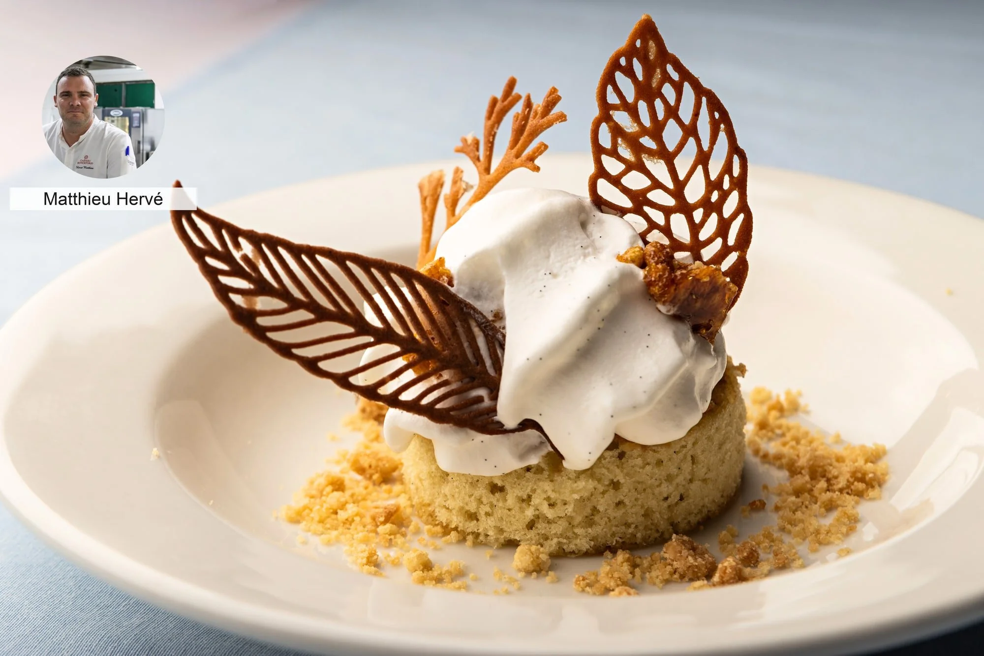 Cream dessert with leaf-shaped tuile by chef Matthieu Hervé.