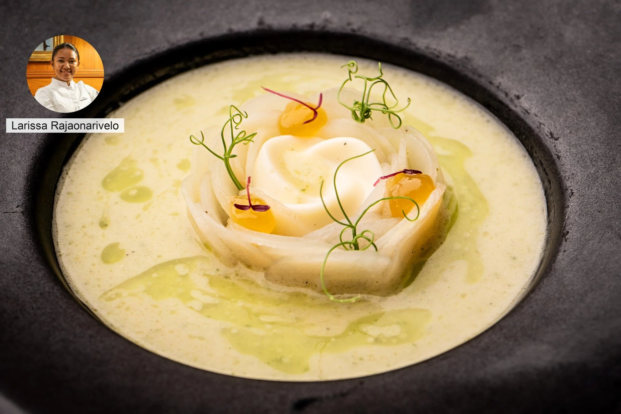 Creamy gourmet dish with ribbon garnish by chef Larissa Rajaonarivelo.