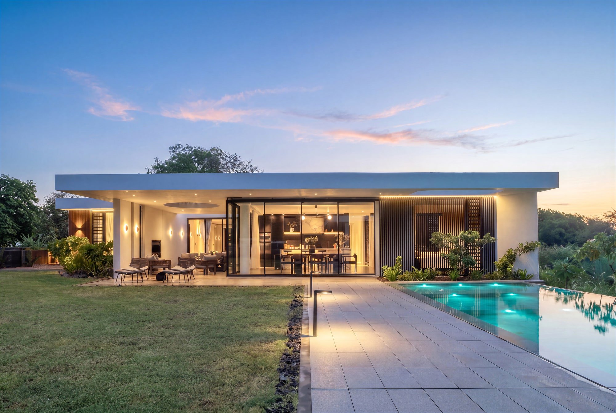 Krono Residence, Mauritius — illuminated single-storey villa and pool terrace.