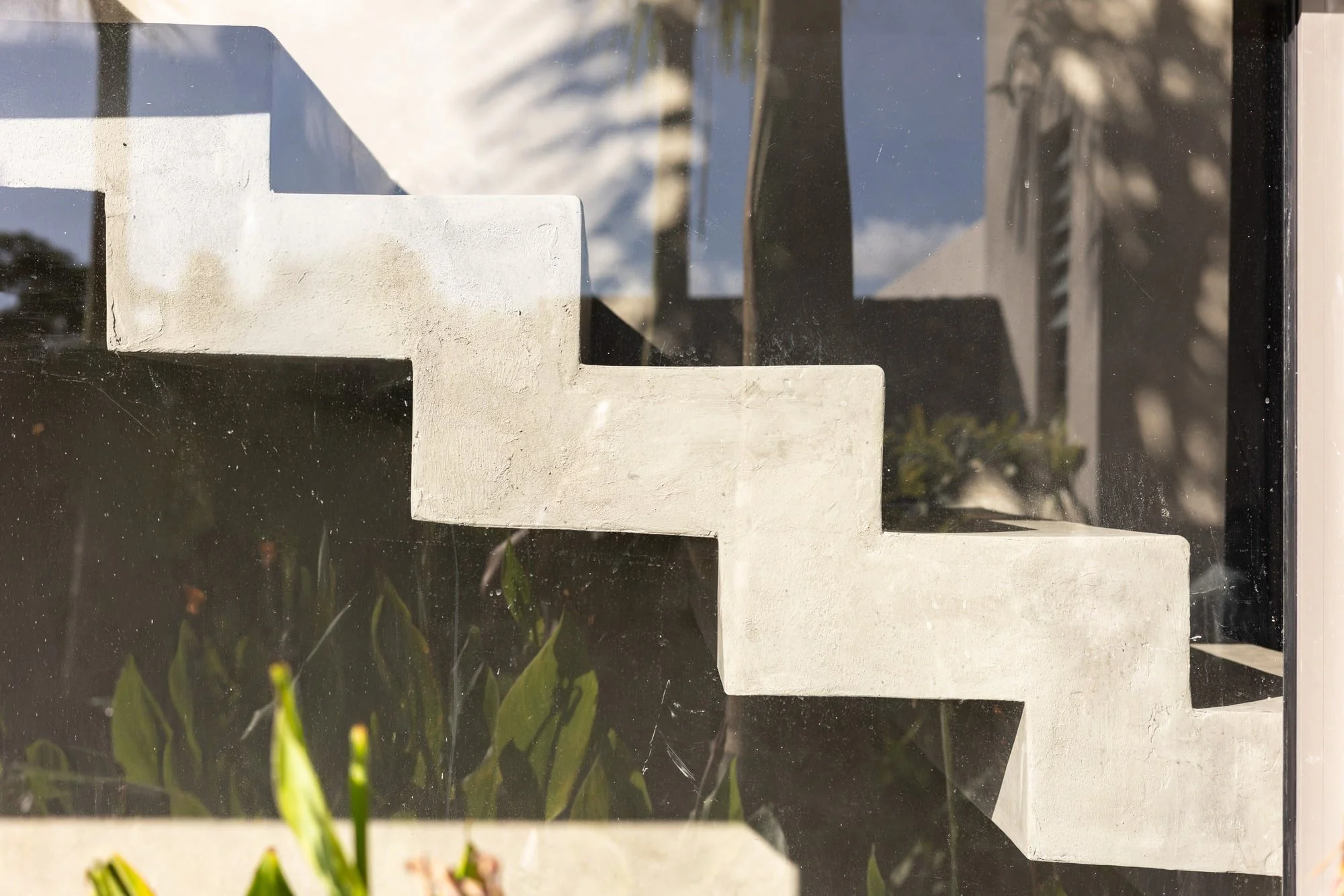 Villa Anahita H15 — geometric concrete staircase and sharp shadows.