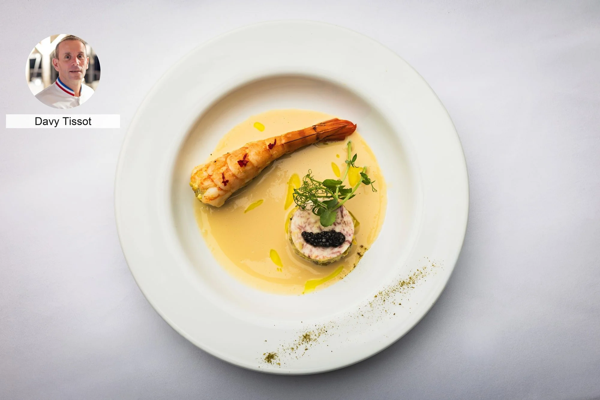 Langoustine with refined gourmet garnish by chef Davy Tissot.